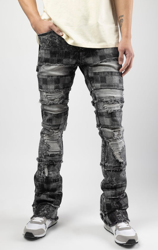 Black wash iconic stacked jeans crafted from high-quality, durable denim fabric consisting of 98% cotton and 2% spandex with a semi flare silhouette and a length of 35"-37". Featuring a distinctive ripped and repair design with pocket patches and a multi-tone dye throughout, these urban-inspired pants are true to size