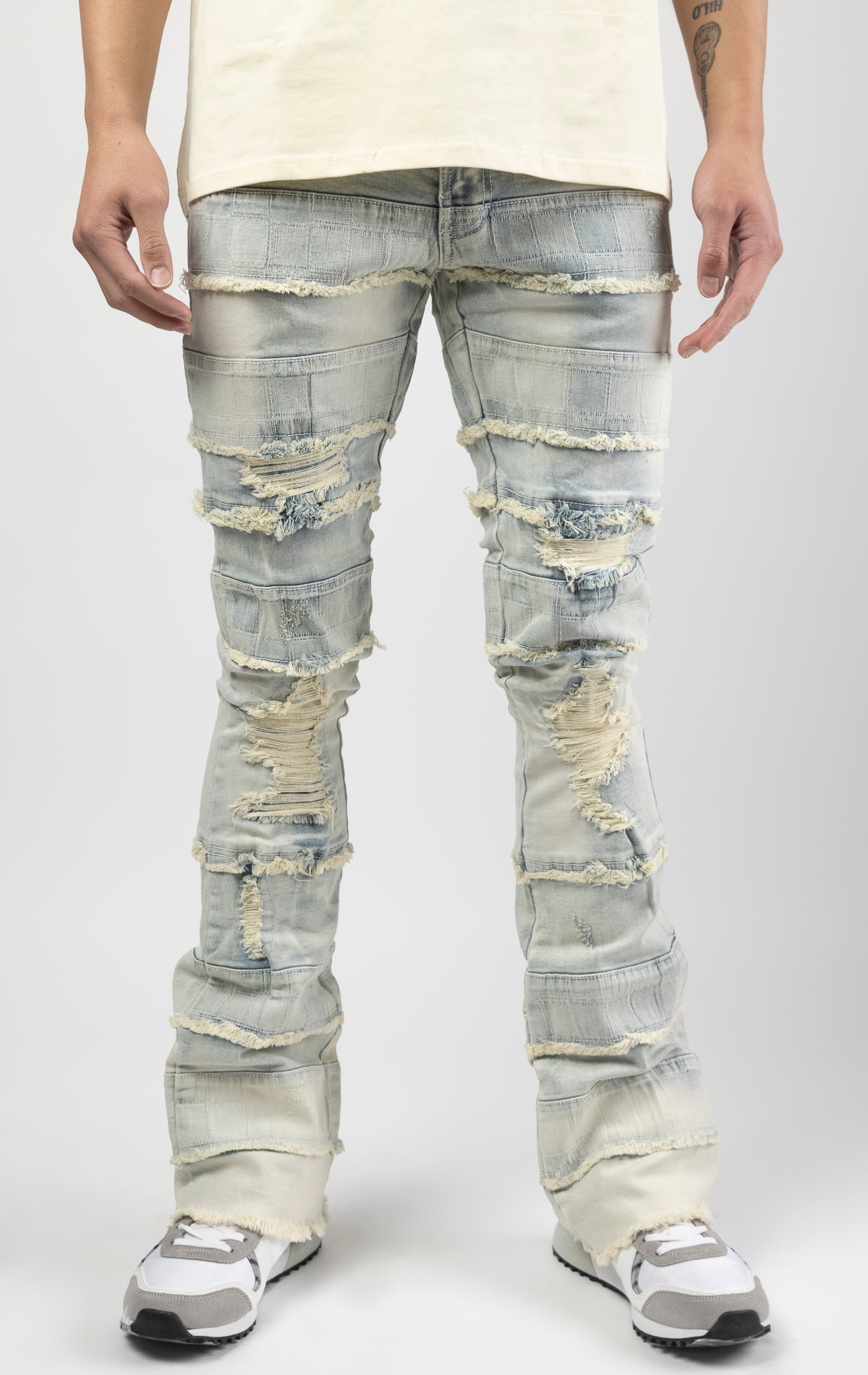 Light wash iconic stacked jeans crafted from high-quality, durable denim fabric consisting of 98% cotton and 2% spandex with a semi flare silhouette and a length of 35