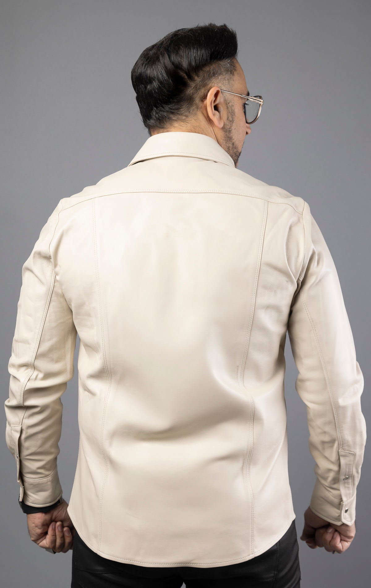 Beige genuine lambskin leather shirt with with two flap chest pockets and snap buttons. 