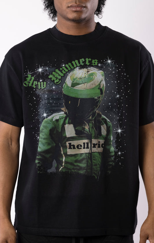 Black t-shirt with a bold graphic of a race-suited rider under a starry night sky, gothic lettering, and a relaxed crewneck fit.