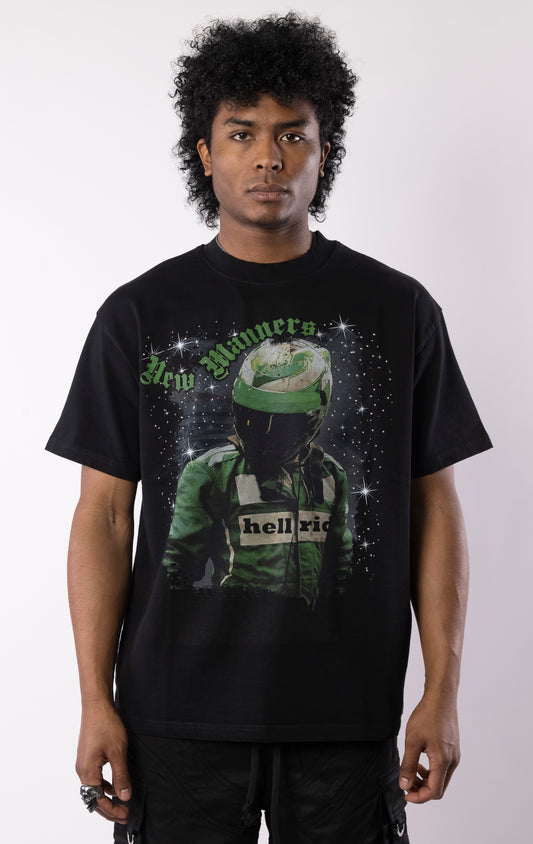 Black t-shirt with a bold graphic of a race-suited rider under a starry night sky, gothic lettering, and a relaxed crewneck fit.
