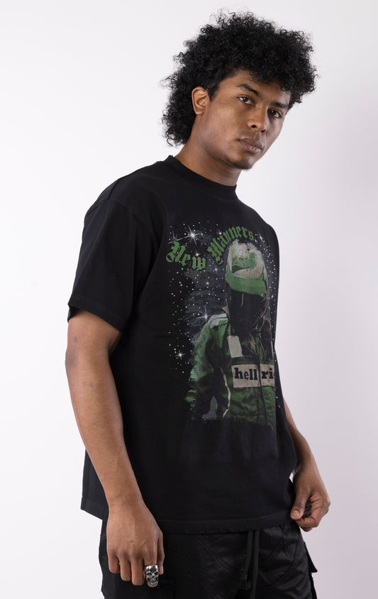 Black t-shirt with a bold graphic of a race-suited rider under a starry night sky, gothic lettering, and a relaxed crewneck fit.