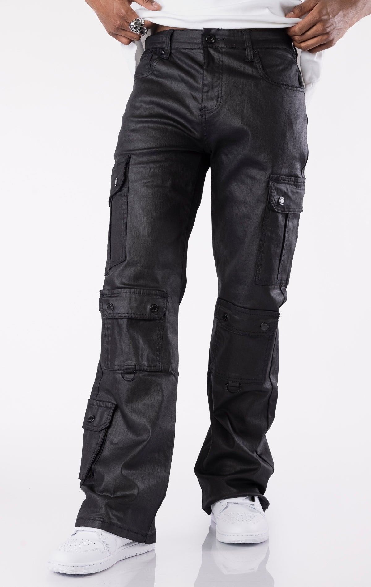 Black wax-coated baggy jeans with multiple cargo pockets and a relaxed fit.