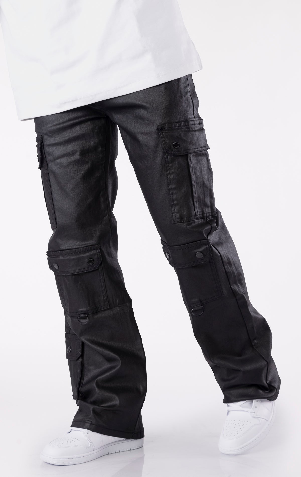 Black wax-coated baggy jeans with multiple cargo pockets and a relaxed fit.