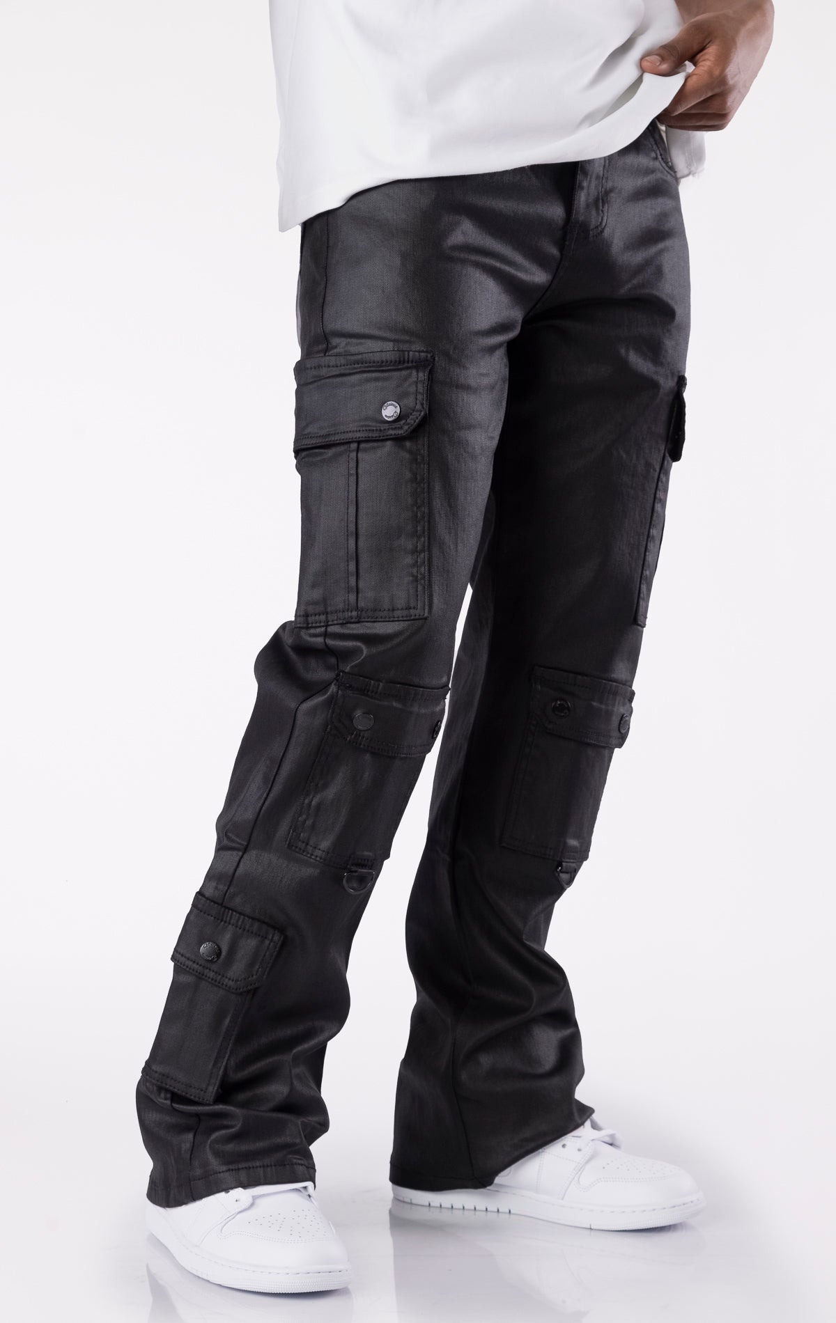 Black wax-coated baggy jeans with multiple cargo pockets and a relaxed fit.