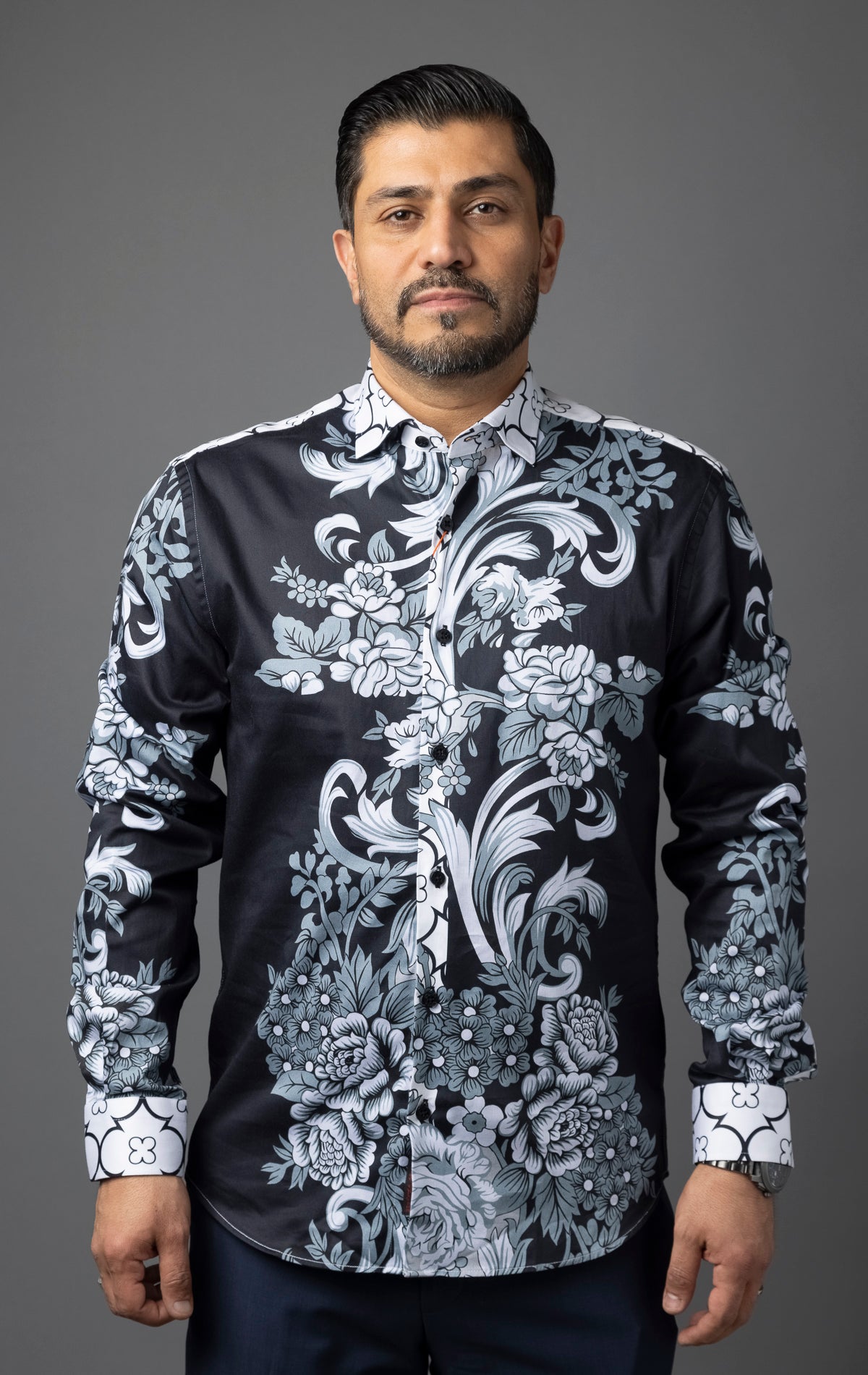 Designer button down long sleeve dress shirt. This shirt features a Slim Fit and is made with high-quality materials for superior feel and long-lasting wear.