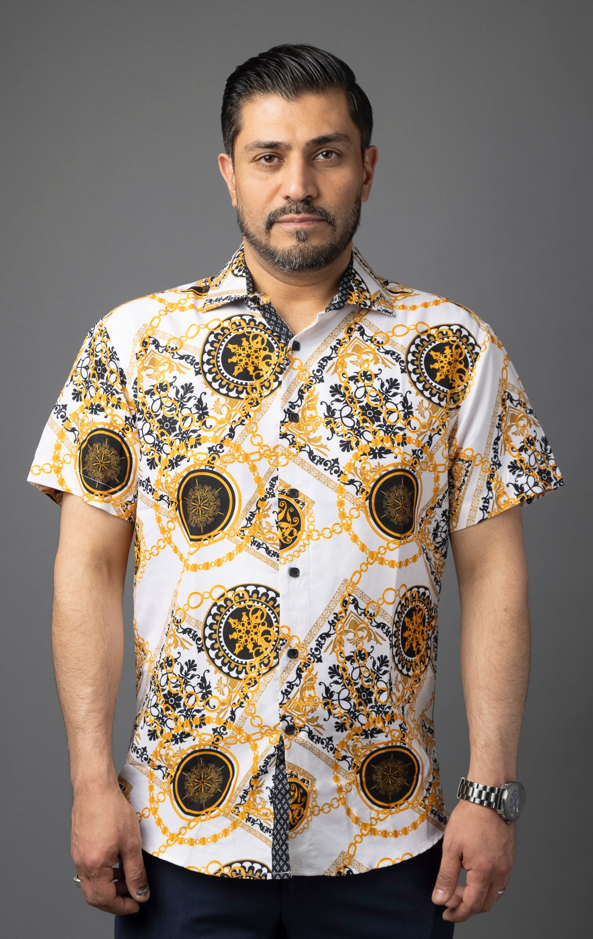 White button up shirt with an all-over print featuring a bold, antique tile chain motif.