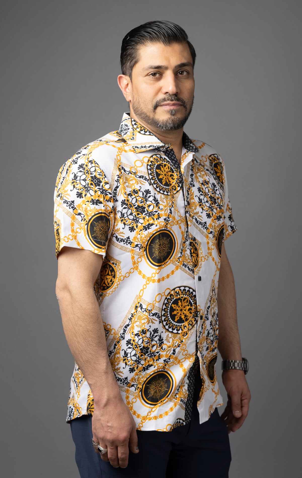 White button up shirt with an all-over print featuring a bold, antique tile chain motif.