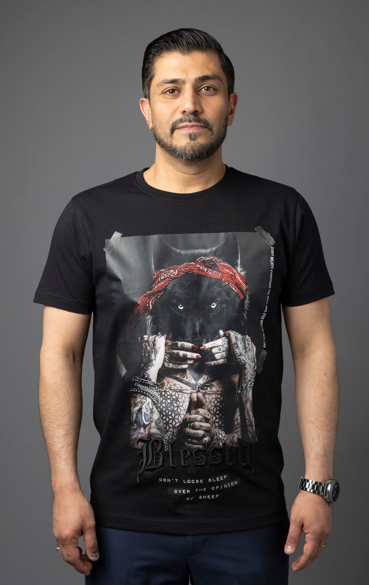 Blessed Inner Voice T-Shirt in black. Made from 100% cotton for a soft and breathable feel. Features a regular fit with slightly elongated fitted sleeves, a "don't loose sleep" message on the front, 3D self-colored "blessed" embroidery, and a woven "blessed" tab on the side seam.