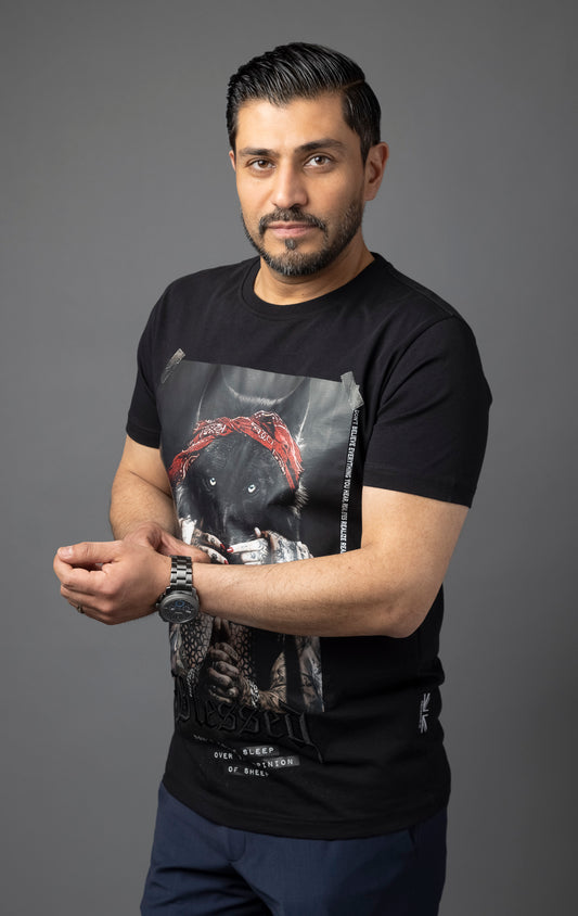 Blessed Inner Voice T-Shirt in black. Made from 100% cotton for a soft and breathable feel. Features a regular fit with slightly elongated fitted sleeves, a "don't loose sleep" message on the front, 3D self-colored "blessed" embroidery, and a woven "blessed" tab on the side seam.