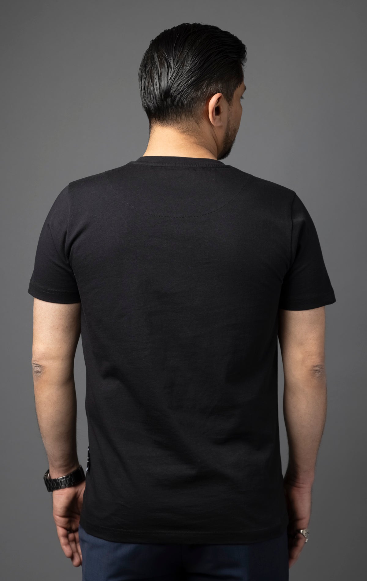 Blessed Inner Voice T-Shirt in black. Made from 100% cotton for a soft and breathable feel. Features a regular fit with slightly elongated fitted sleeves, a "don't loose sleep" message on the front, 3D self-colored "blessed" embroidery, and a woven "blessed" tab on the side seam.