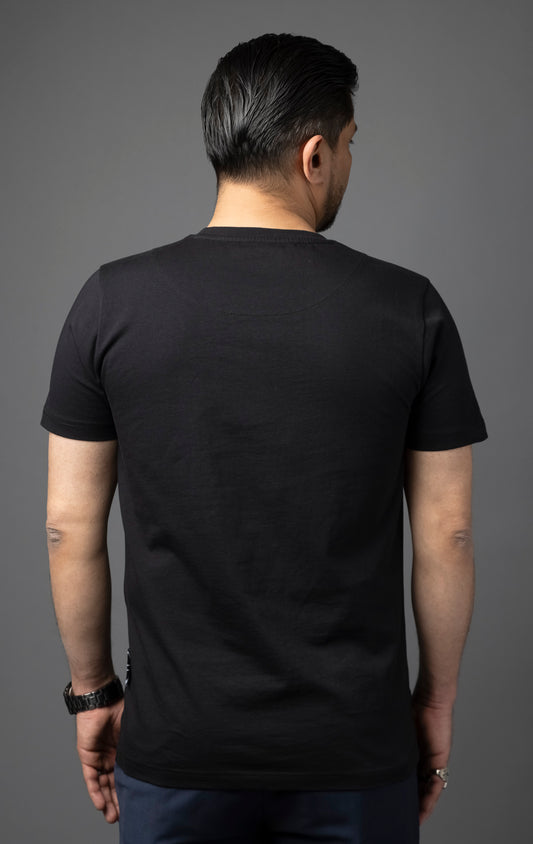 Blessed Inner Voice T-Shirt in black. Made from 100% cotton for a soft and breathable feel. Features a regular fit with slightly elongated fitted sleeves, a "don't loose sleep" message on the front, 3D self-colored "blessed" embroidery, and a woven "blessed" tab on the side seam.