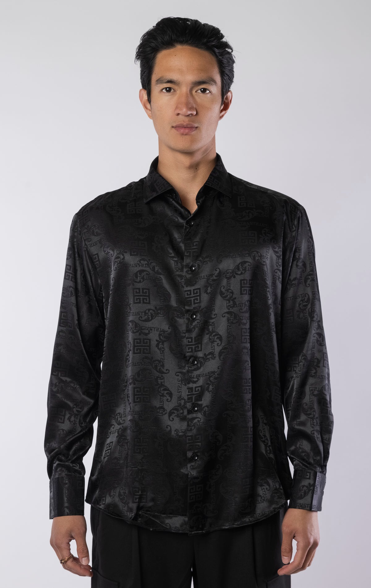 Men’s black long sleeve modern fit dress shirt with contrast cuffs and collar, made from a lightweight 97% polyester, 3% spandex blend.