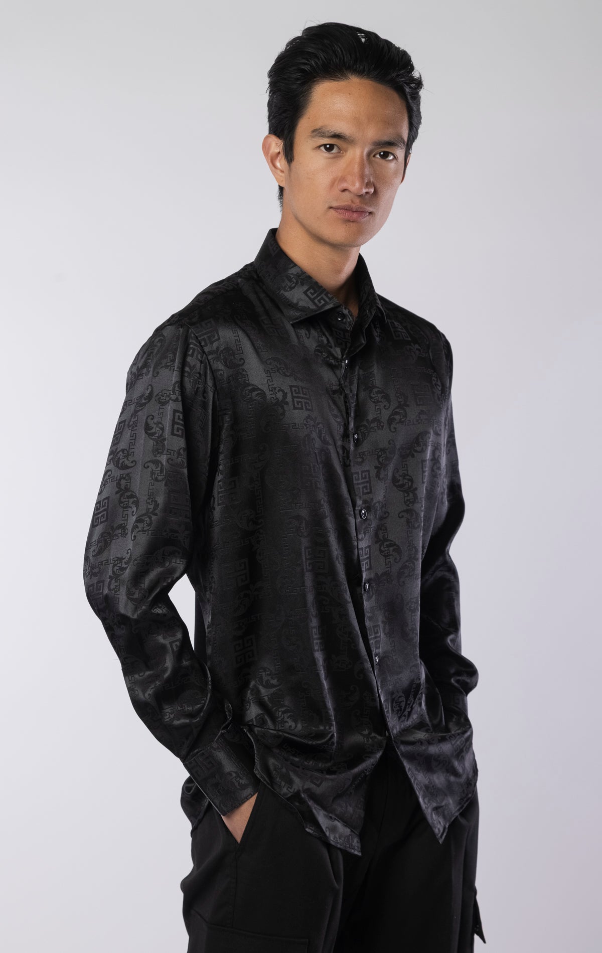 Men’s black long sleeve modern fit dress shirt with contrast cuffs and collar, made from a lightweight 97% polyester, 3% spandex blend.