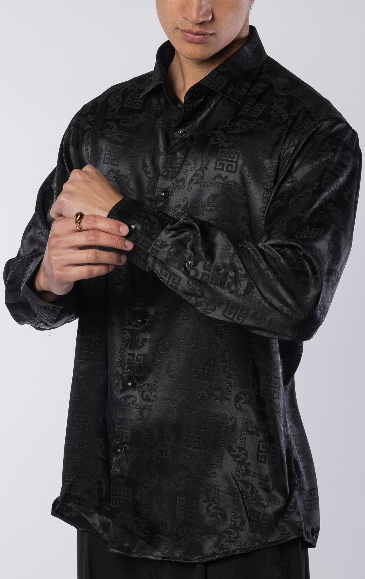 Men’s black long sleeve modern fit dress shirt with contrast cuffs and collar, made from a lightweight 97% polyester, 3% spandex blend.