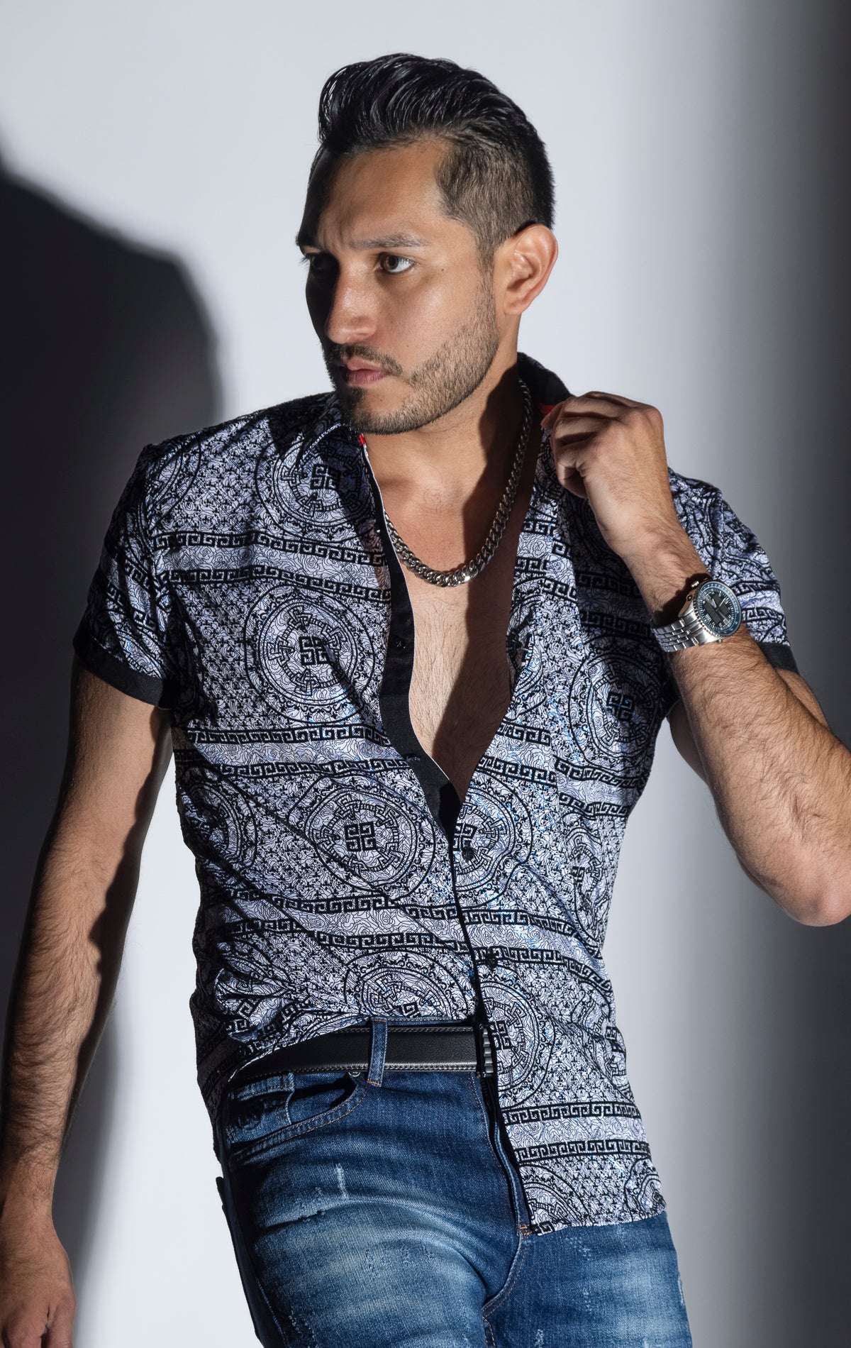 Men's casual, relaxed-fit button-down shirt with a short sleeve design. The shirt features an all-over Greek key pattern and a front button closure.