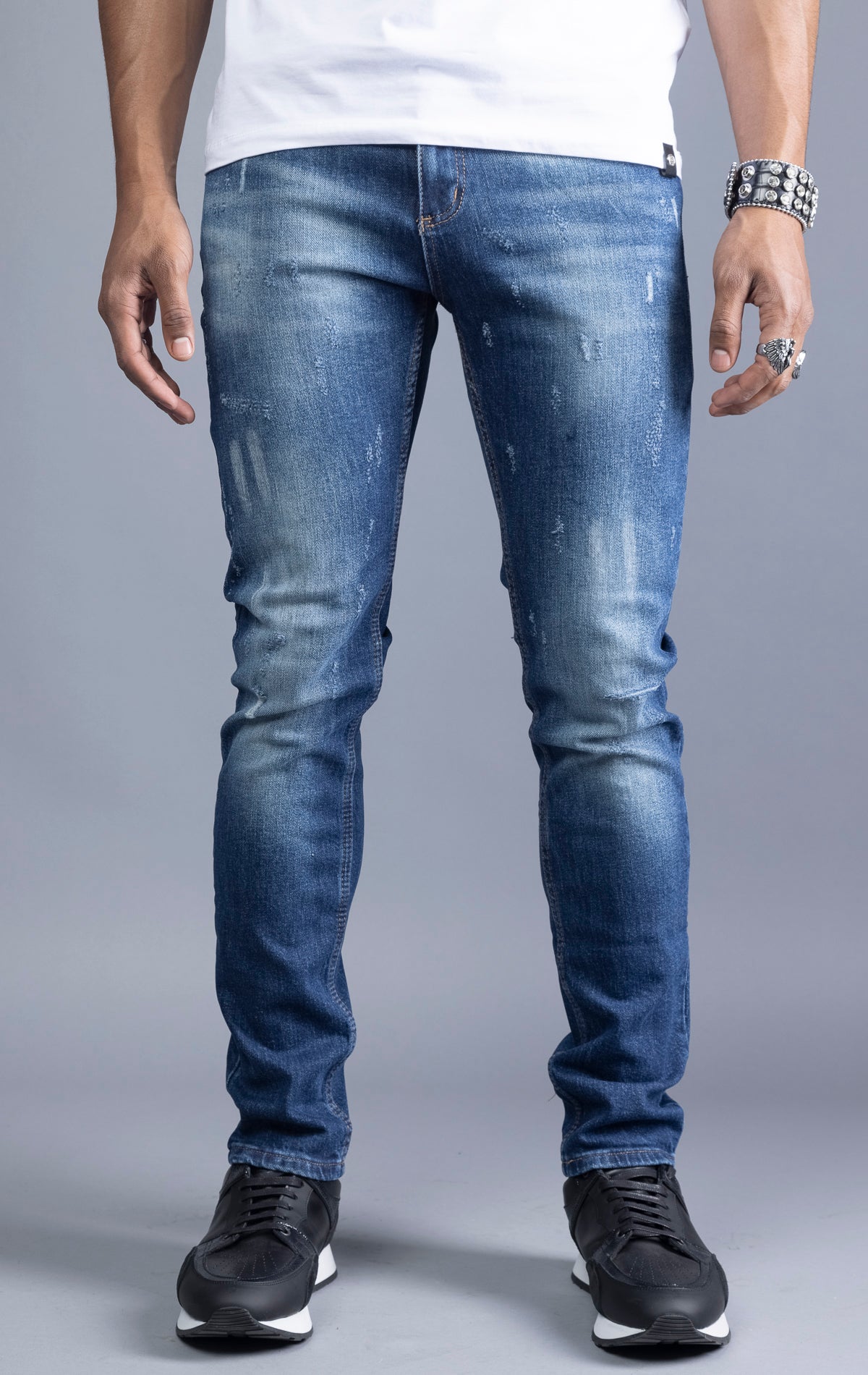 Blue slim-fit jeans with a narrow leg opening and five pockets.