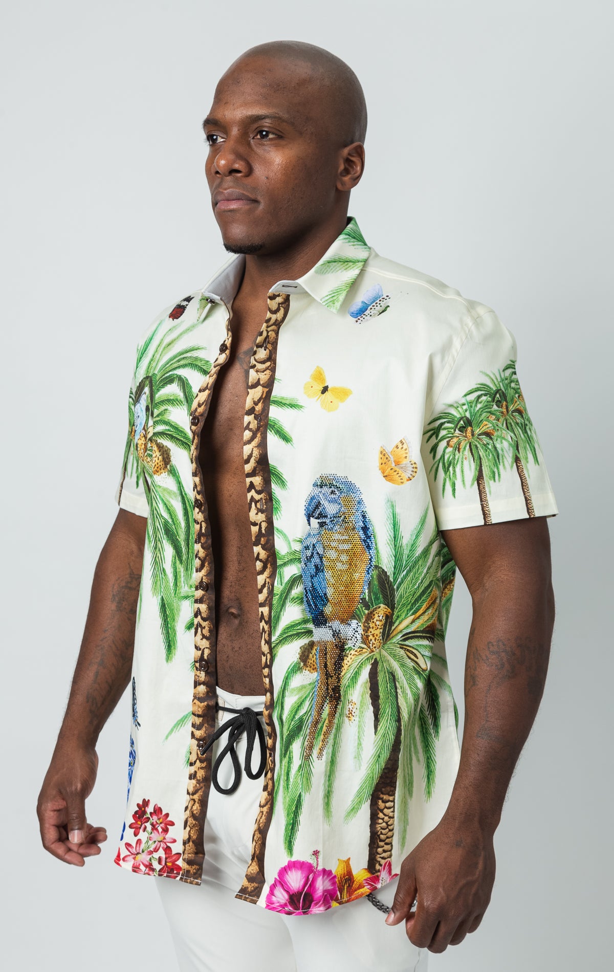Button up, short sleeve shirt with tropical pattern