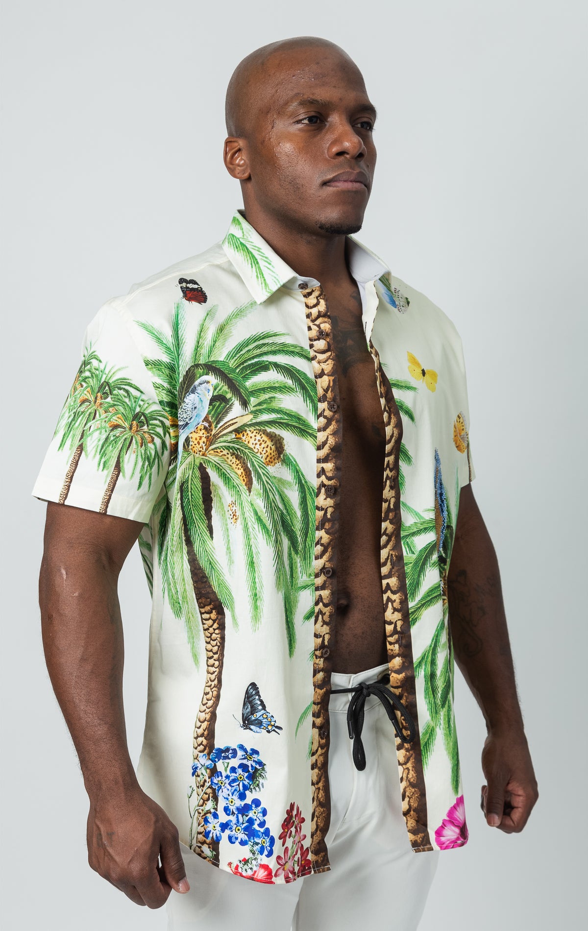 Button up, short sleeve shirt with tropical pattern