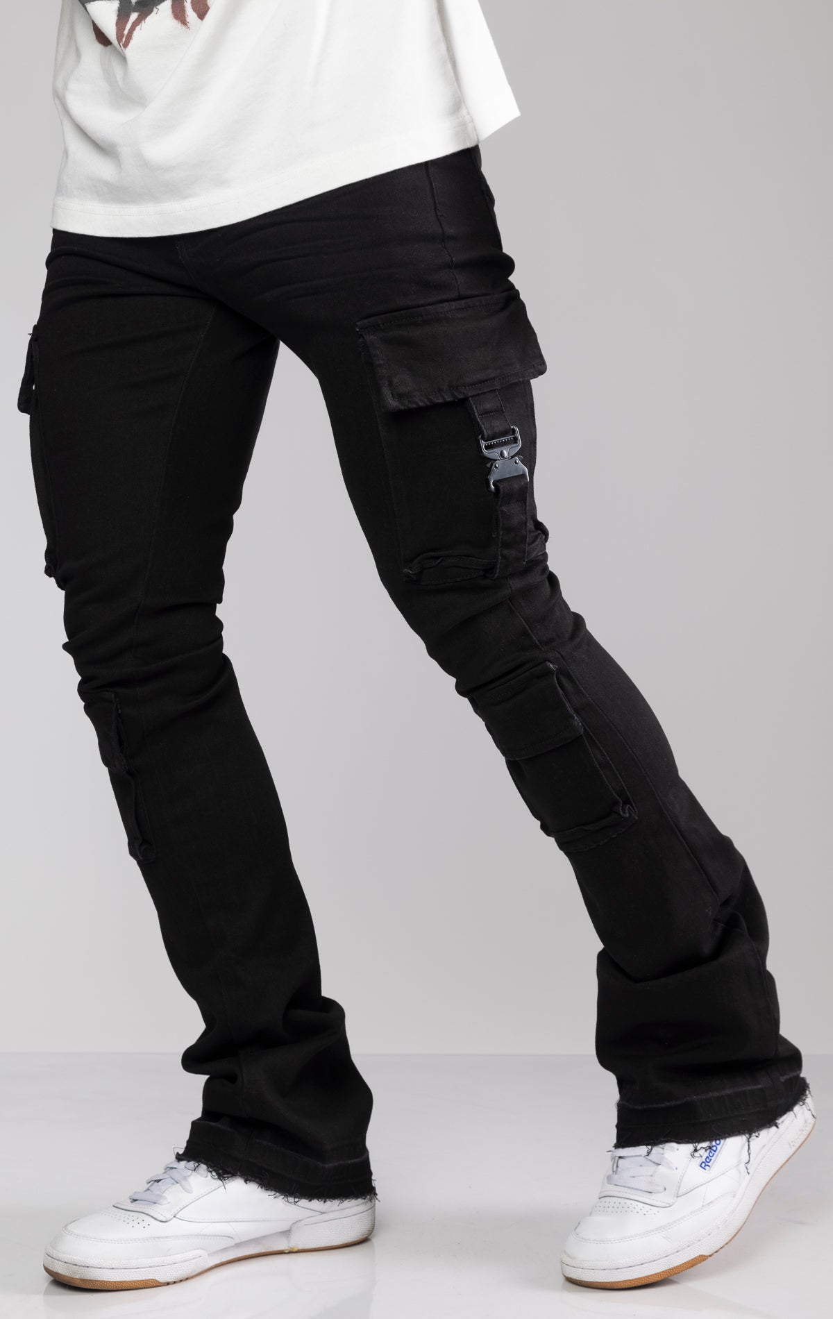 Black stacked cargo jeans. Made from premium stretch twill with a comfortable fit and featuring a stacked silhouette at the ankle.