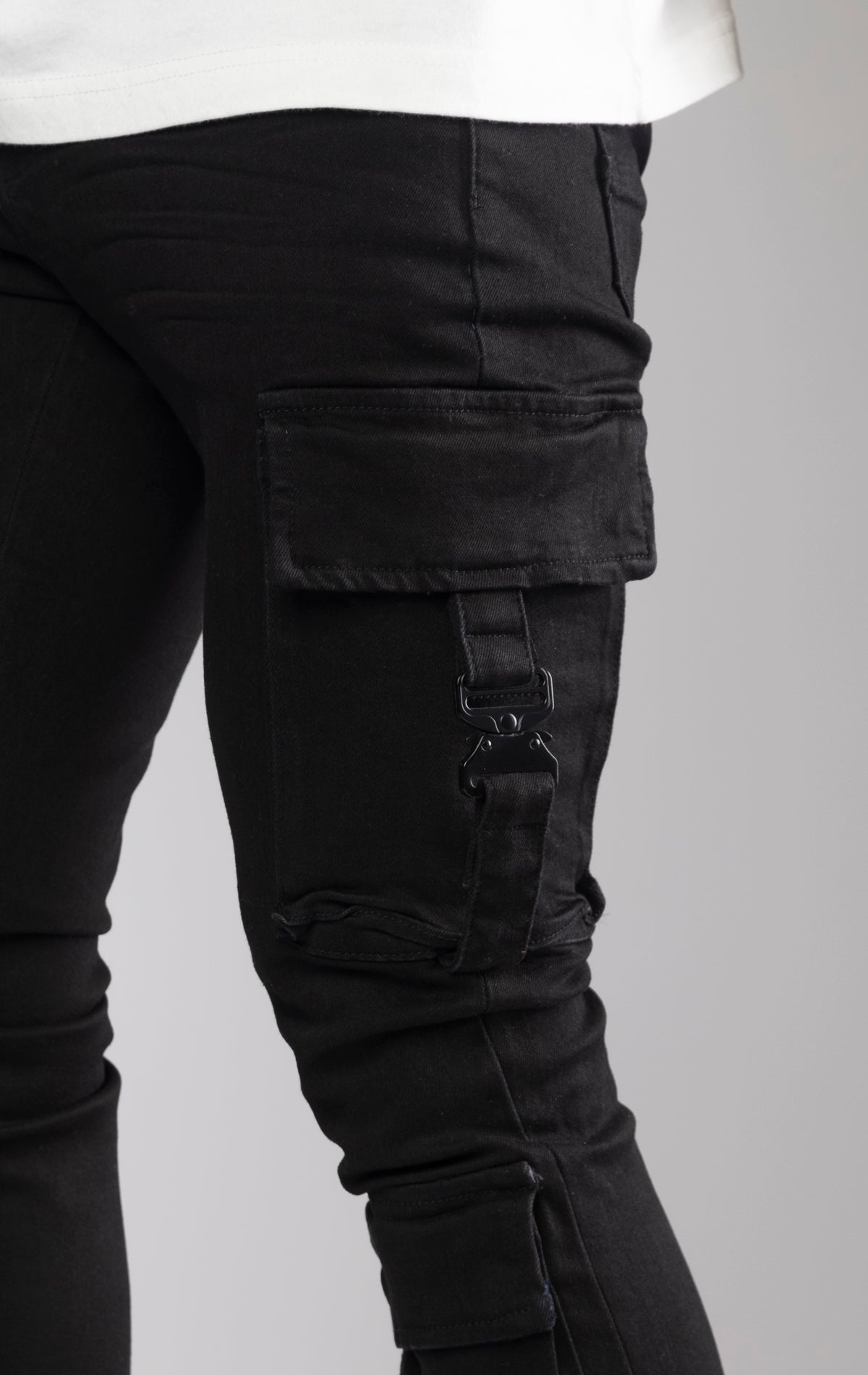 Black stacked cargo jeans. Made from premium stretch twill with a comfortable fit and featuring a stacked silhouette at the ankle.
