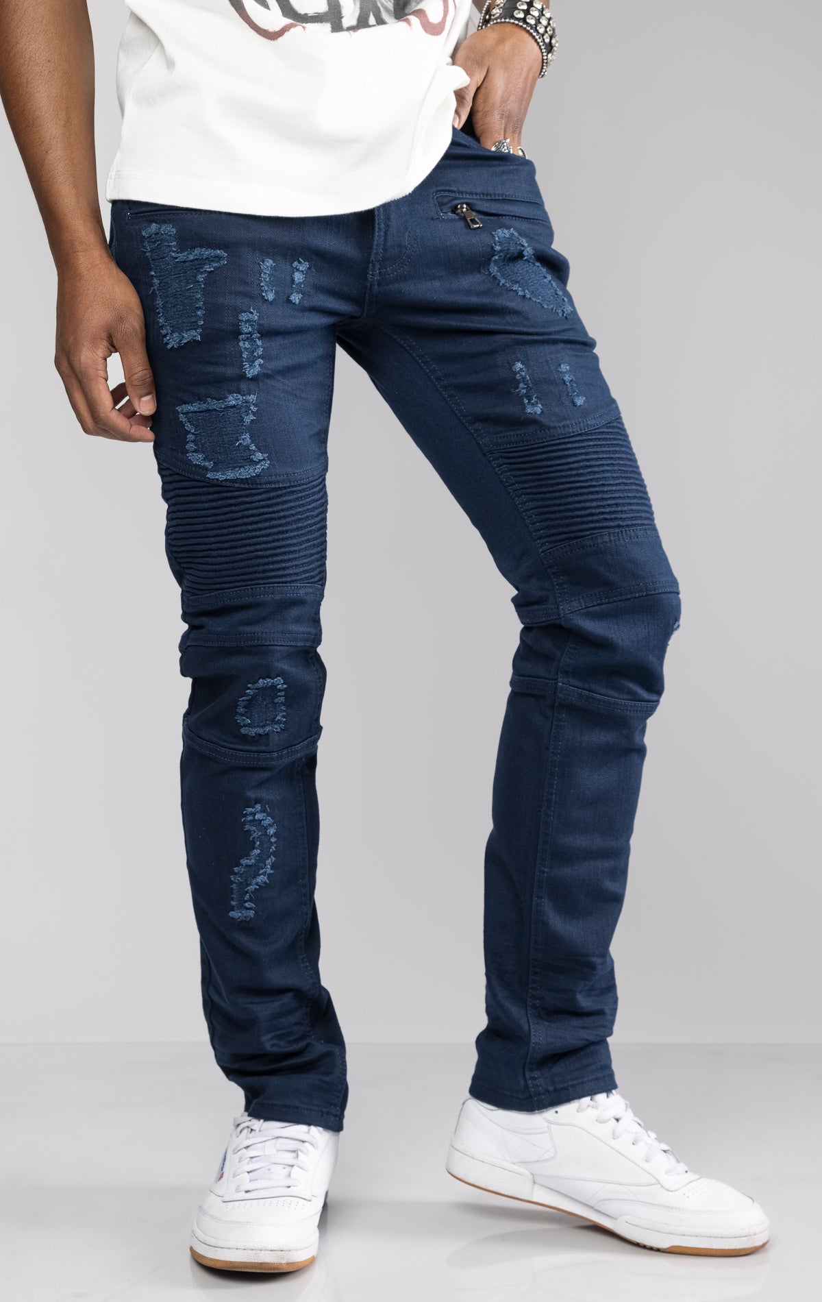 Navy Slim fit denim jeans with rip and repair details made from 98% cotton and 2% spandex.