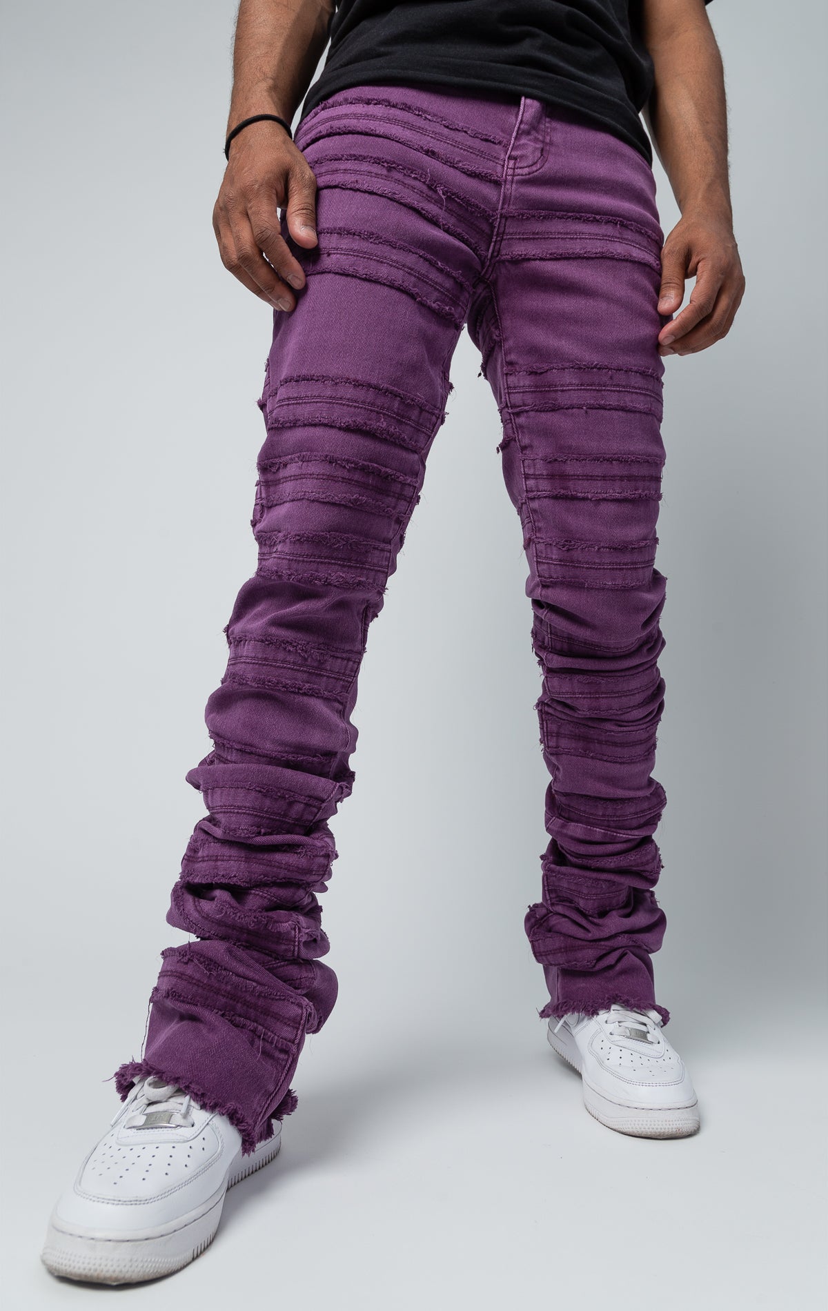 Stacked denim pants in purple