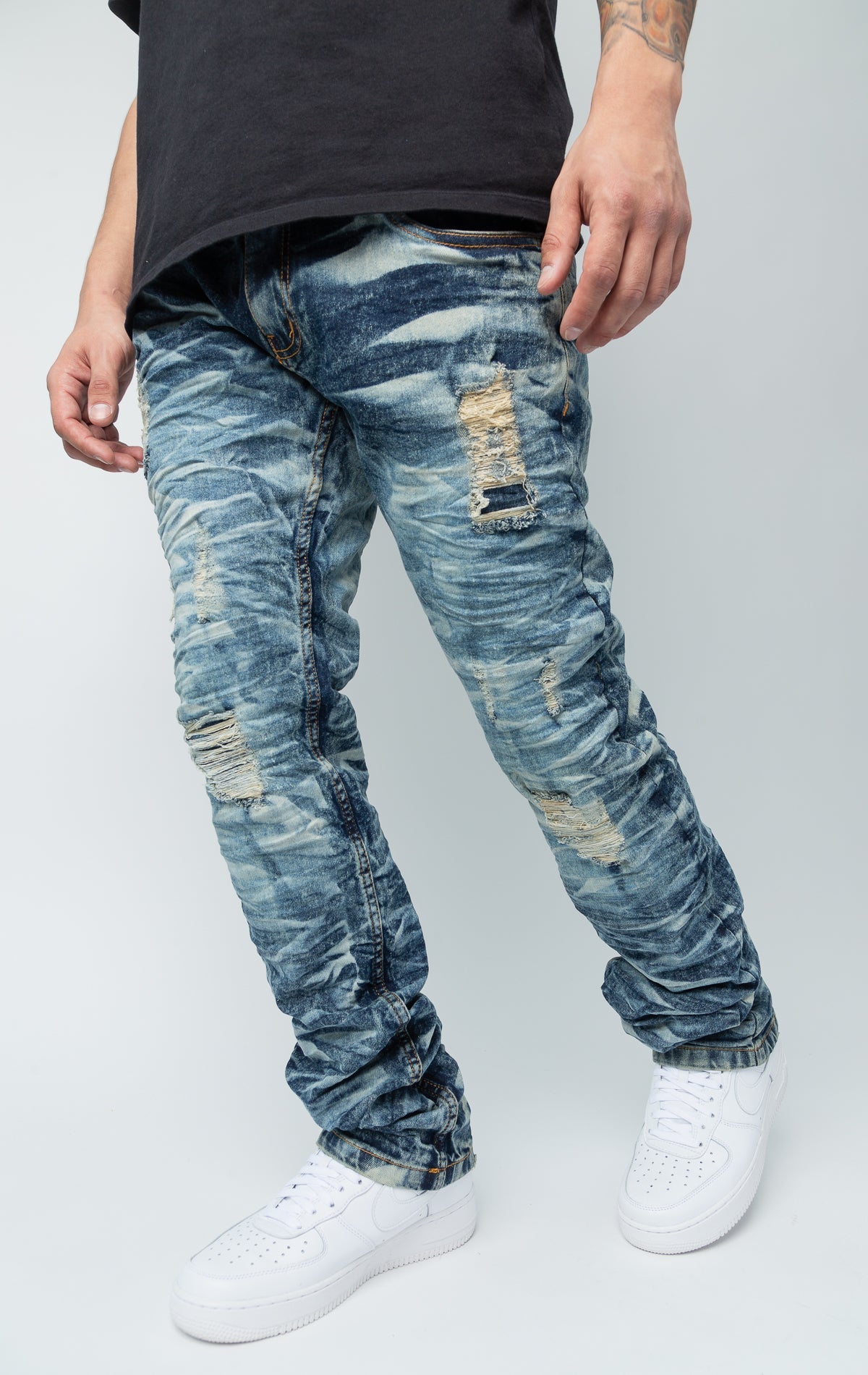 Blue ripped low-waisted slim jeans.