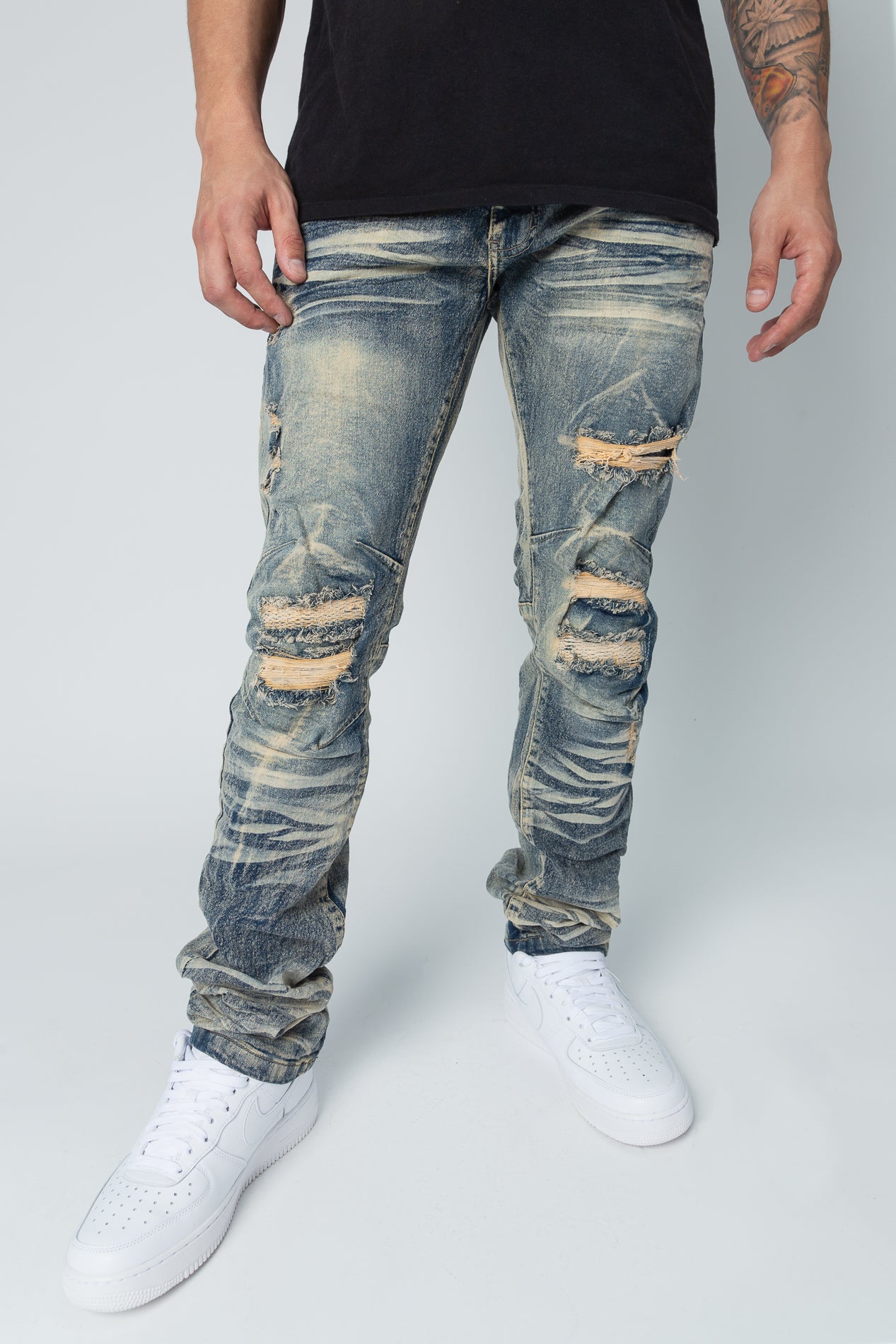 Light tint Washed up slim fit denim jeans, rip and repair style.