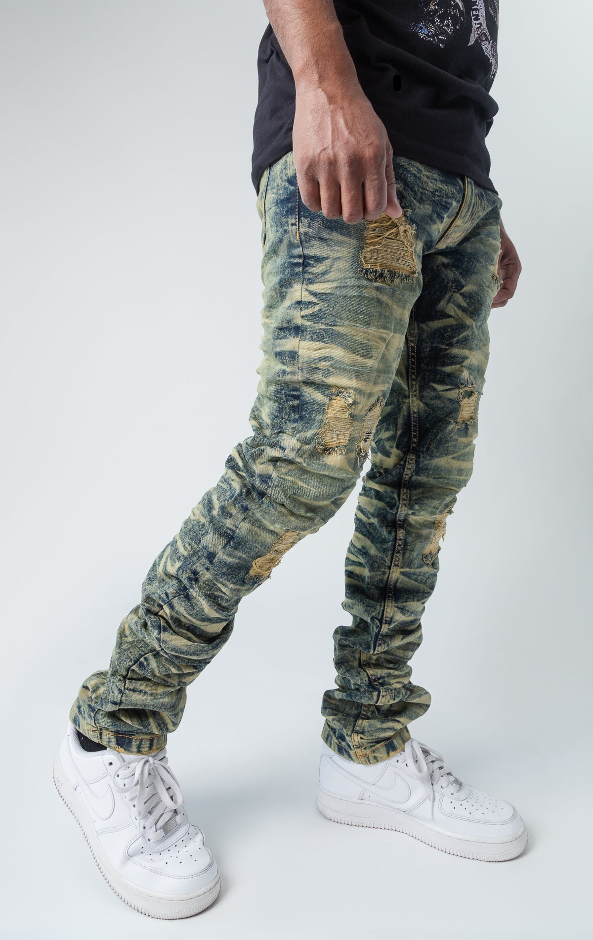 Tinted ripped low-waisted slim jeans.