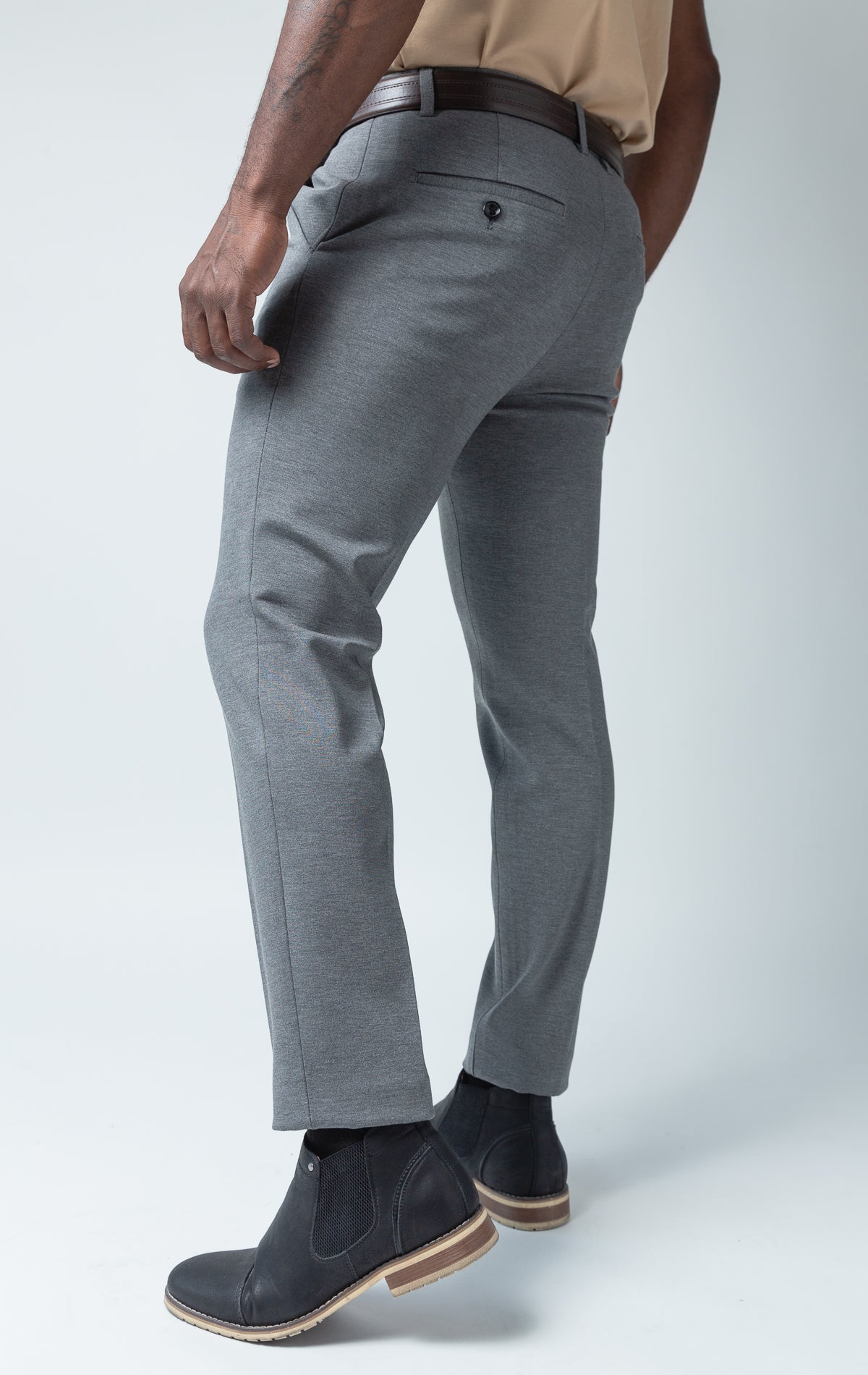 Grey dress pants with elastic waistband technology.