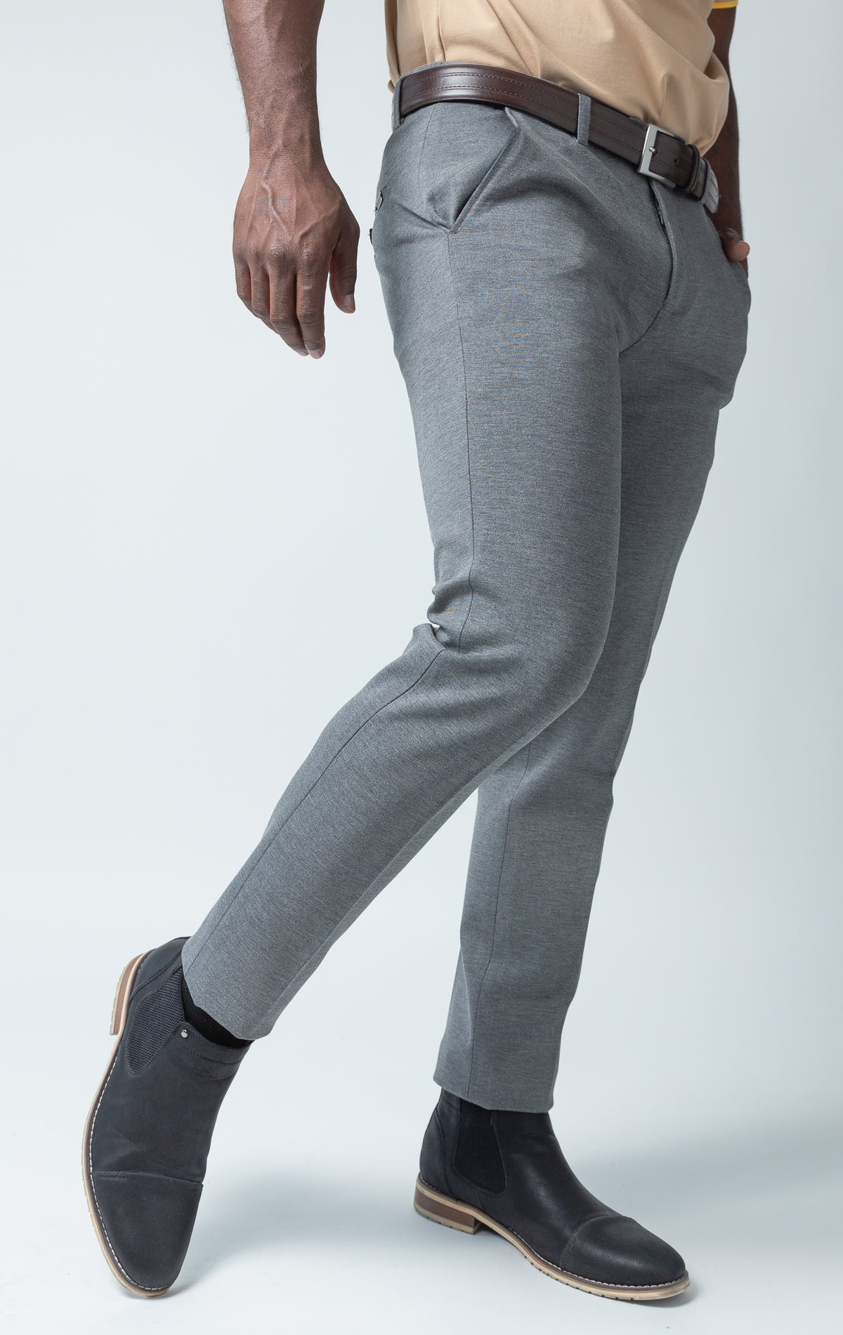 Grey dress pants with elastic waistband technology.