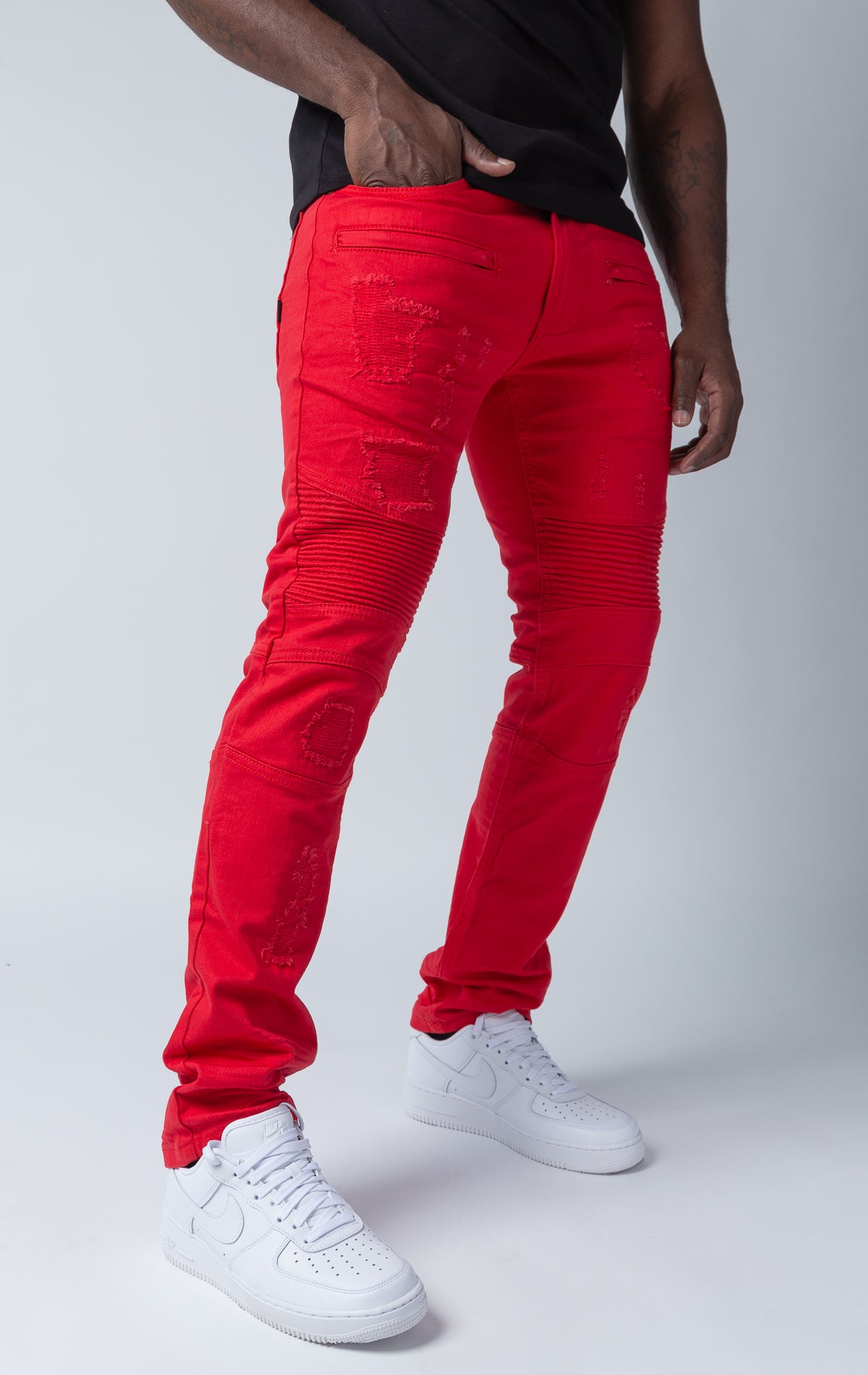 Red pants with rip and repair design and slim fit