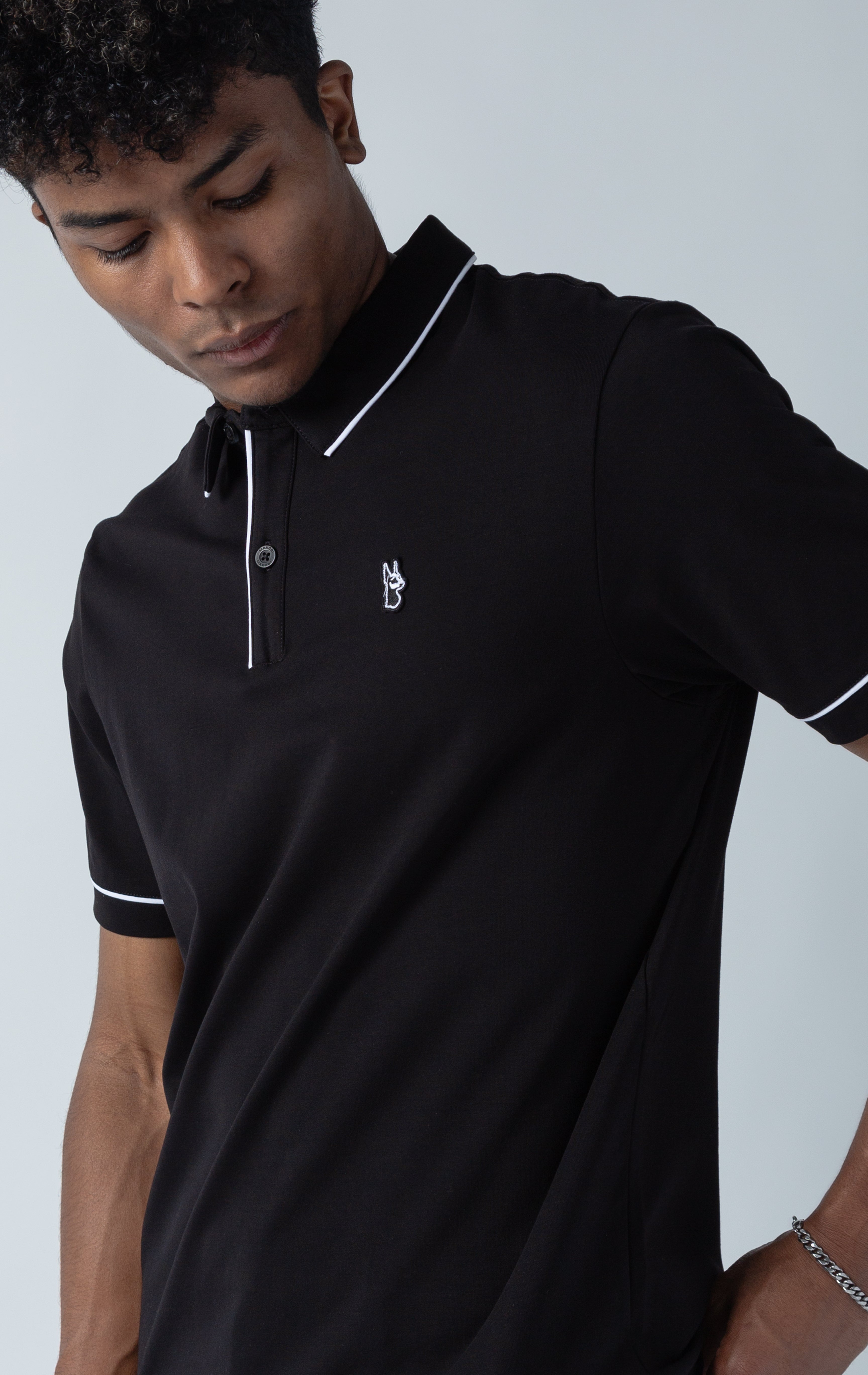 Black Luciano stretch premium jersey polo shirt with collared detailing, short-sleeved composition, three button front fastening. MAKOBI custom made design