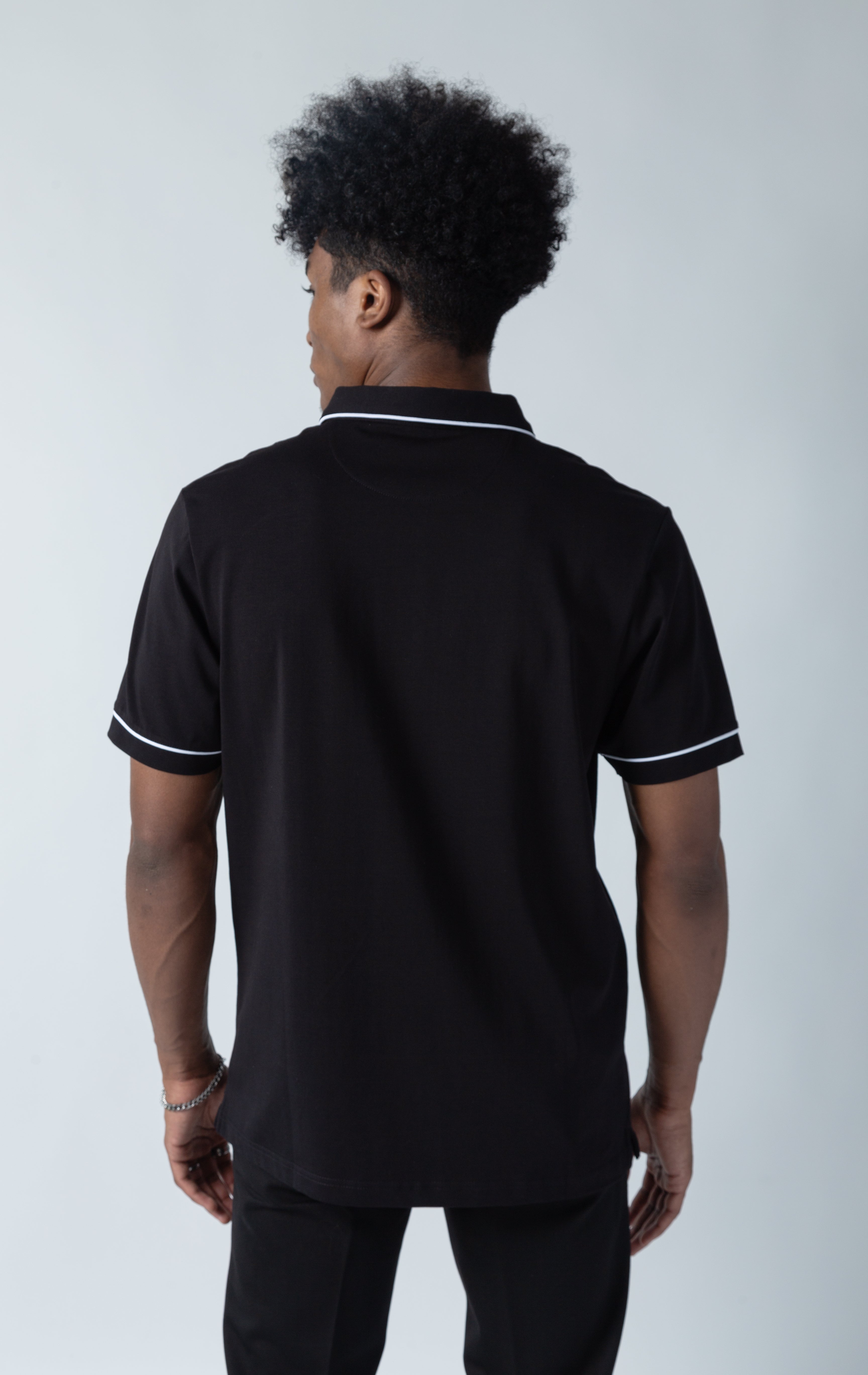 Black Luciano stretch premium jersey polo shirt with collared detailing, short-sleeved composition, three button front fastening. MAKOBI custom made design 