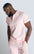 Pink Luciano stretch premium jersey polo shirt with collared detailing, short-sleeved composition, three button front fastening. MAKOBI custom made design
