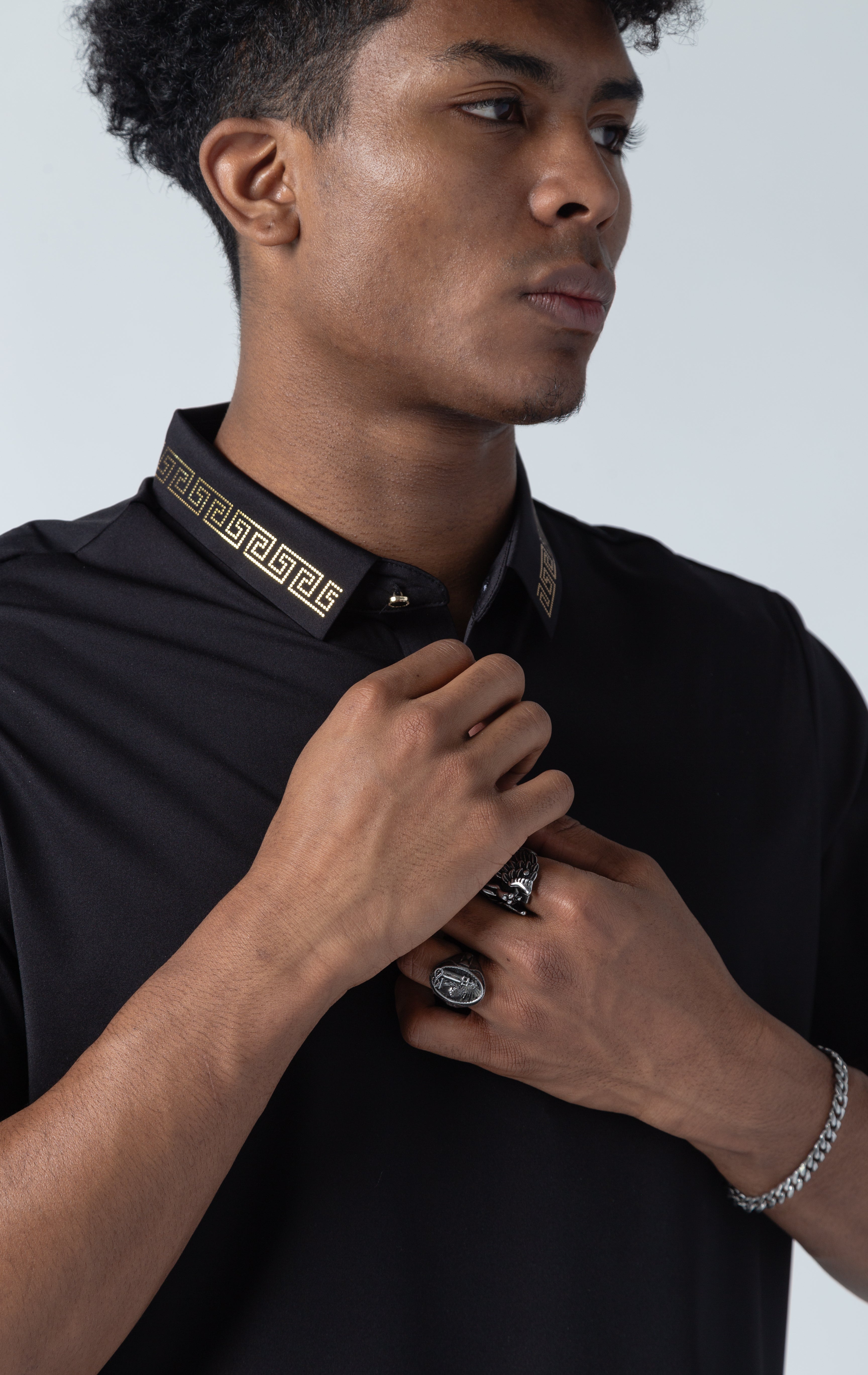 Greek key pattern luxury black polo shirts with the lines of rhinestone on the collar.