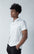 White  polo shirt with a line on the collar and 3 buttons closure collar with a contrasted accent.