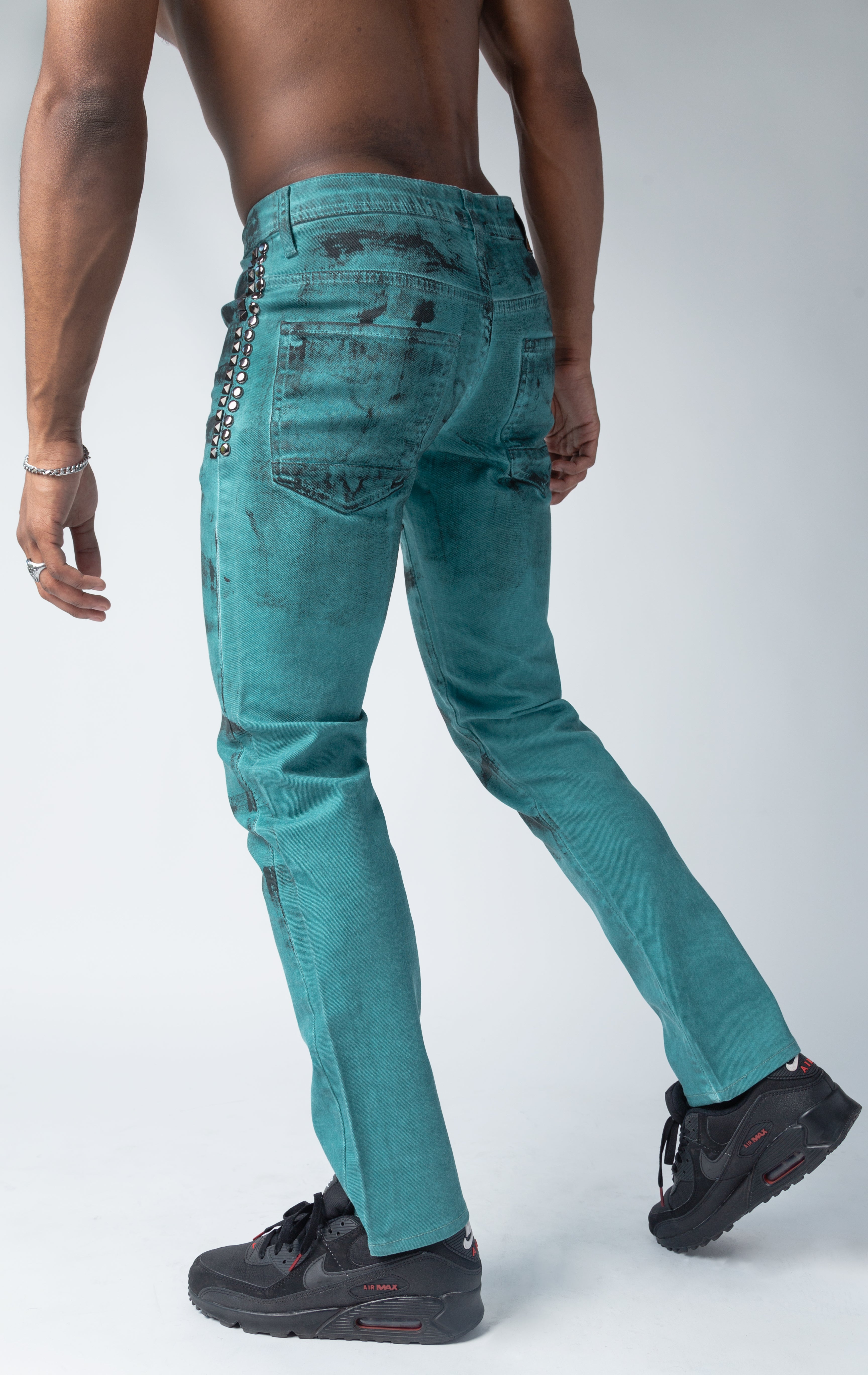 Jade color pants with distressed style 