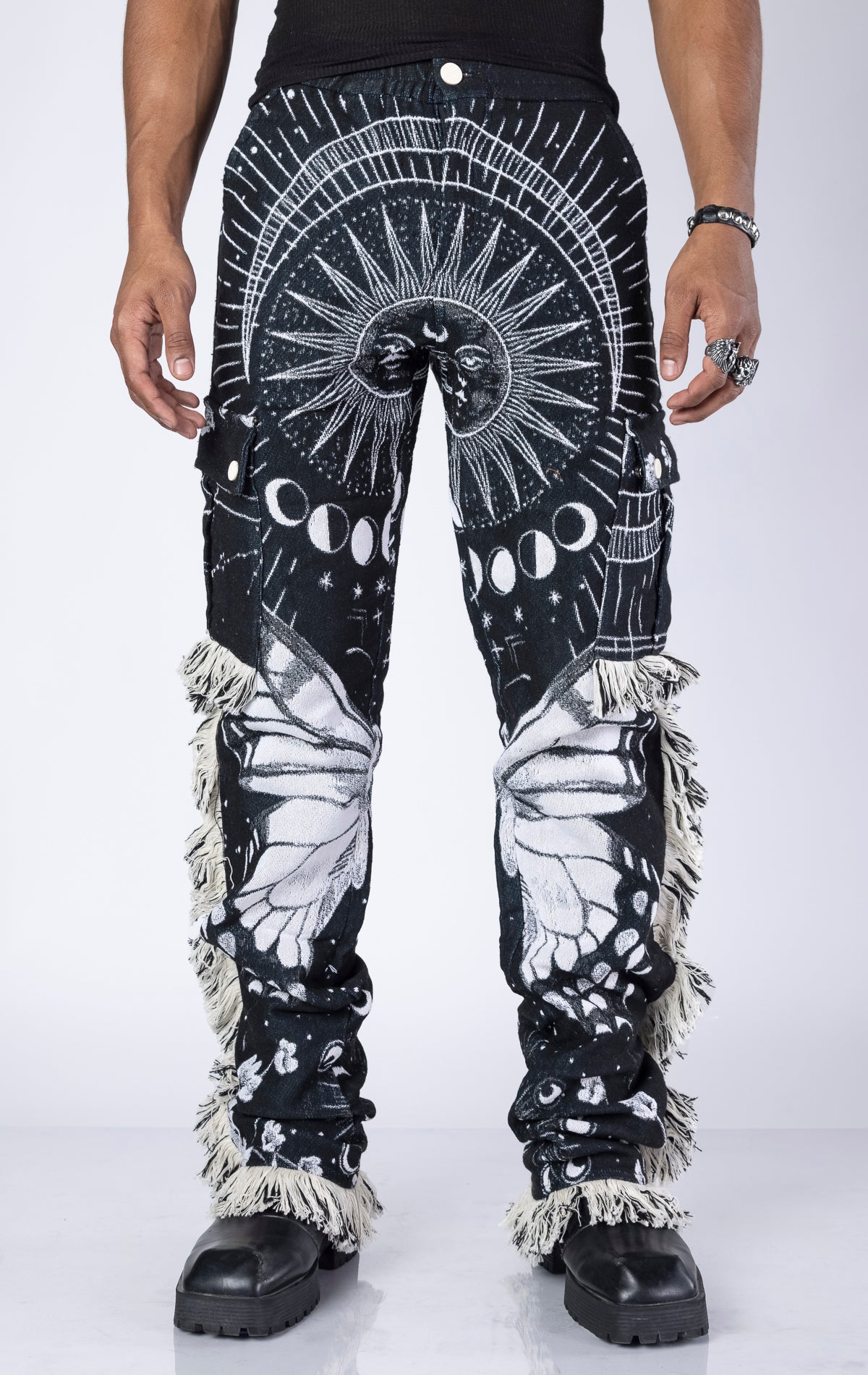 Obsidian Black Tapestry Pants. Made from 100% luxury cotton for superior comfort. Features a straight leg fit, allover tapestry print, cargo pockets, fringe accents, and custom hardware.