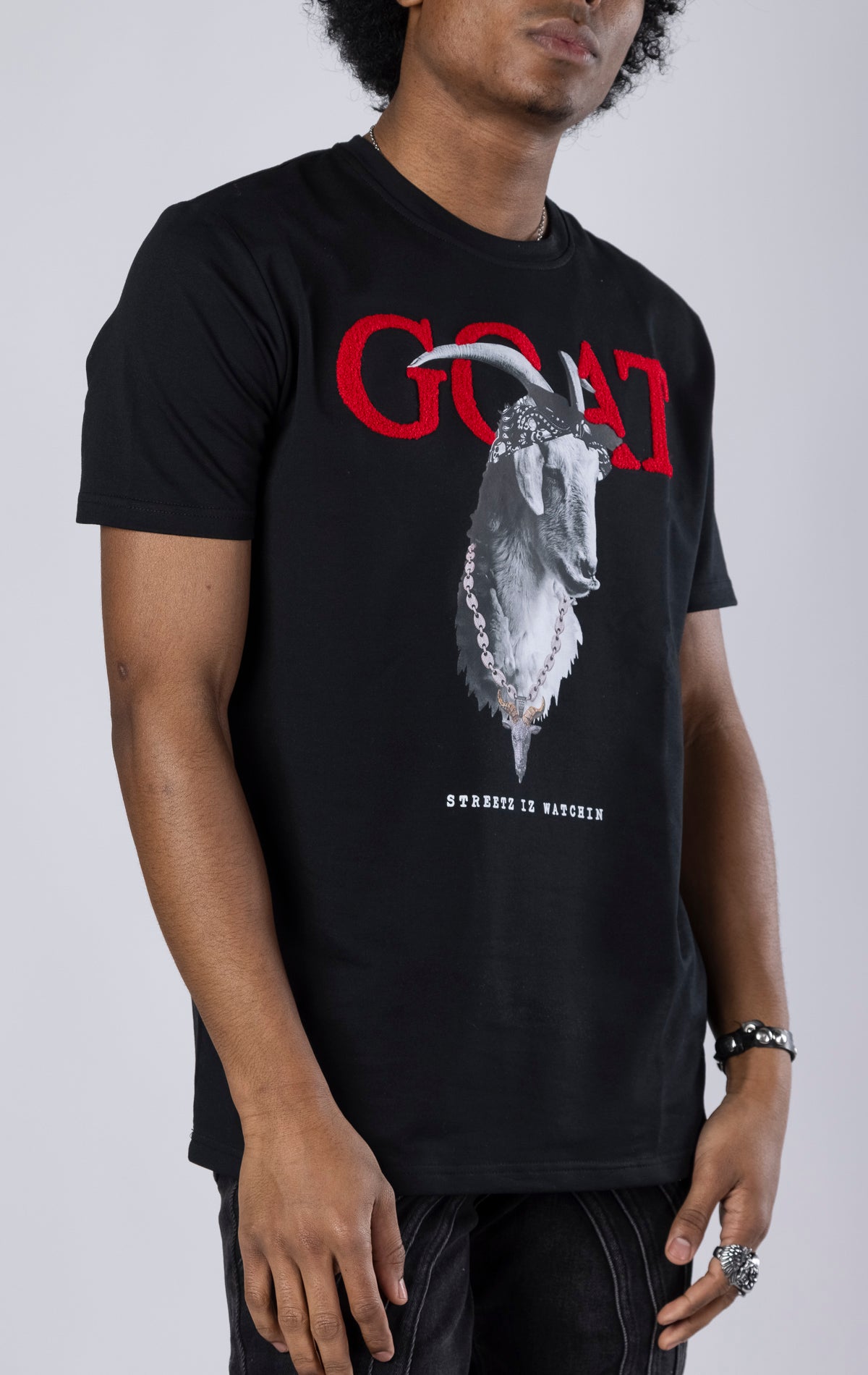 Goat Graphic Tee. Features a bold goat graphic, short sleeves, and a ribbed crewneck collar. Made from soft cotton