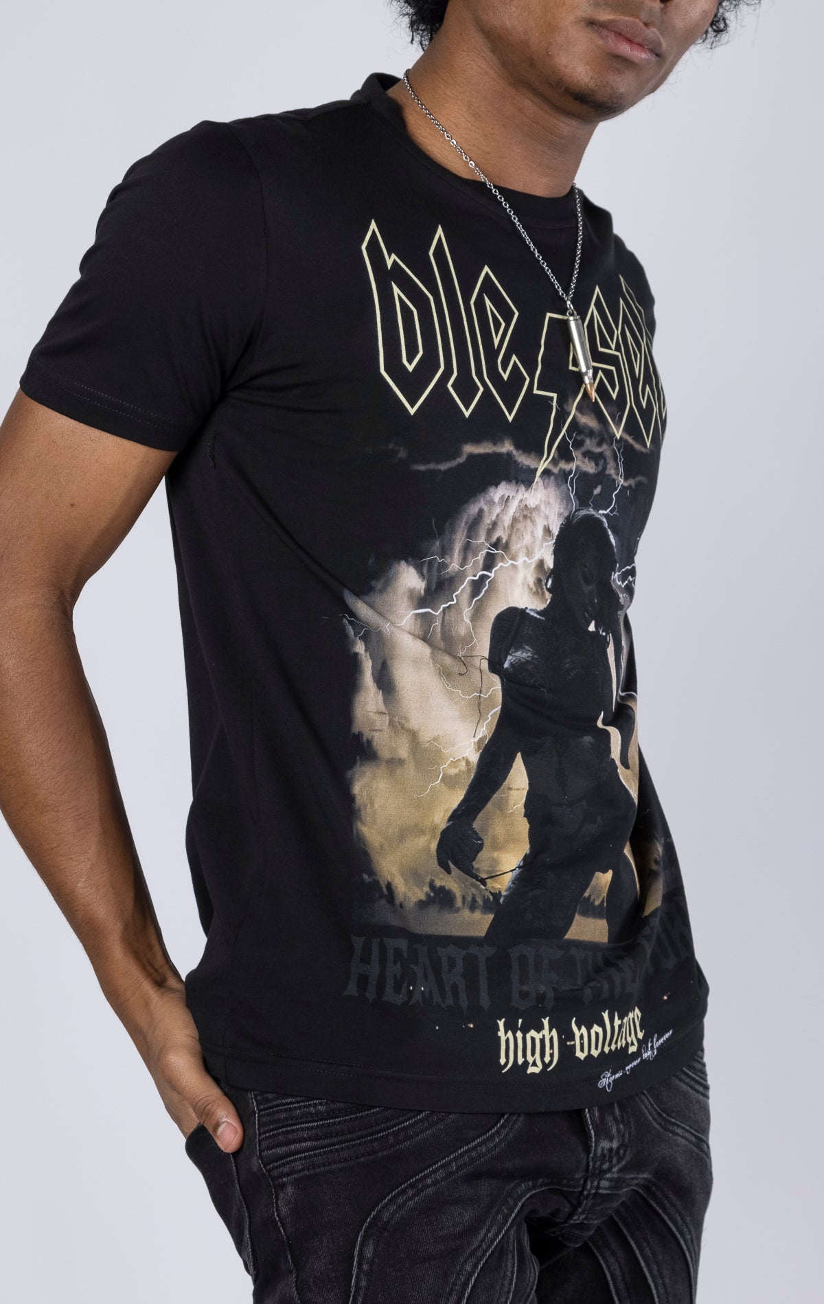 Heart of the Storm Crewneck Tee. Features a "heart of the storm" soft-touch digital print and 3D embroidered "blessed" detail. Made from 100% 190gsm mid-weight cotton jersey.