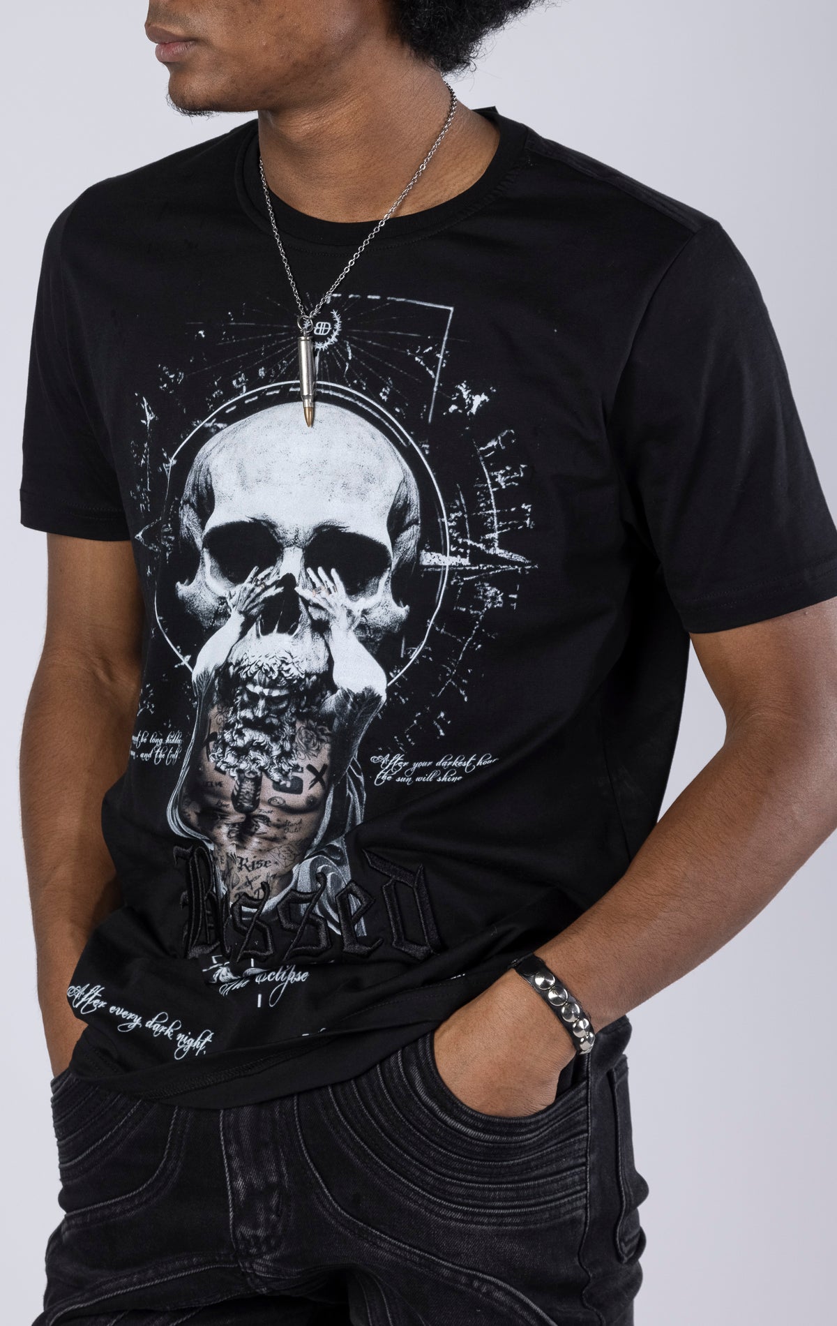 Blessed Eclipse Crewneck Tee. Features a soft-touch digital eclipse print, 3D embroidered "blessed" detail, and a woven "blessed" tab. Made from 100% 190gsm mid-weight cotton jersey.