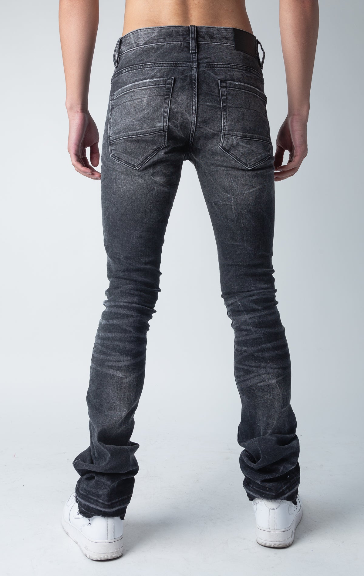 black shadow jeans with 3D wrinkles, rip and repair design