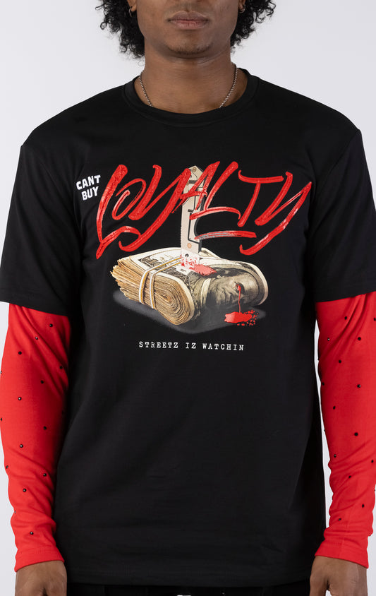 Black short-sleeve t-shirt with a red long-sleeve underneath, featuring a graphic of a stack of money stabbed by a knife and red blood. The word "LOYALTY" is printed in large red script, with "CANT BUY" and "STREETZ IZ WATCHIN" completing the design.