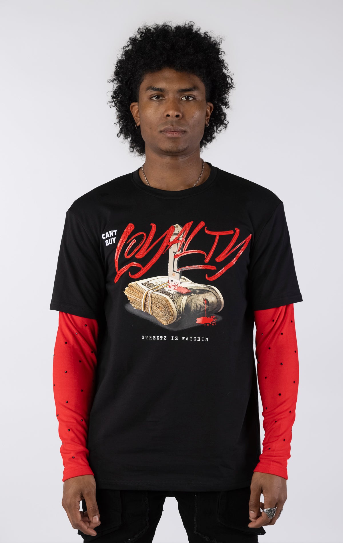 Black short-sleeve t-shirt with a red long-sleeve underneath, featuring a graphic of a stack of money stabbed by a knife and red blood. The word 