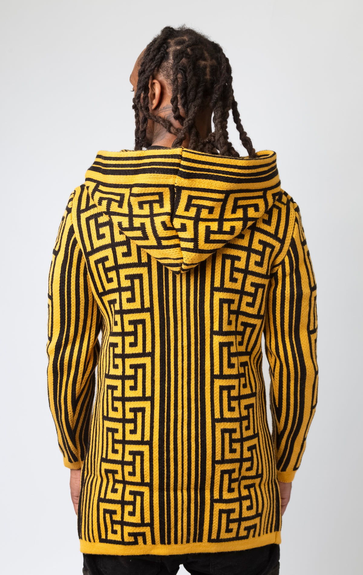 Mustard colored cardigan with a hood, front pocket, and pattern design.