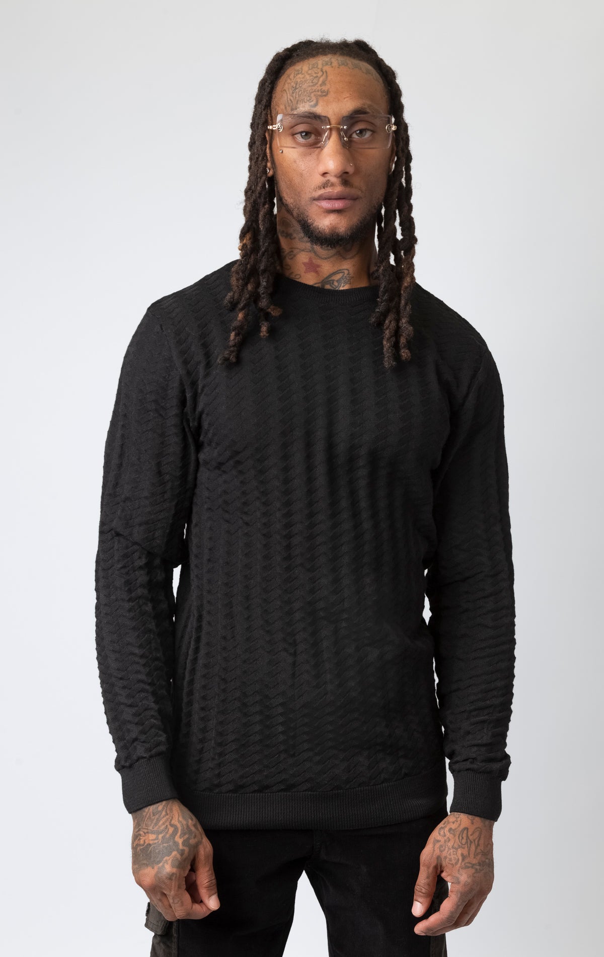  textured black crew neck sweater.