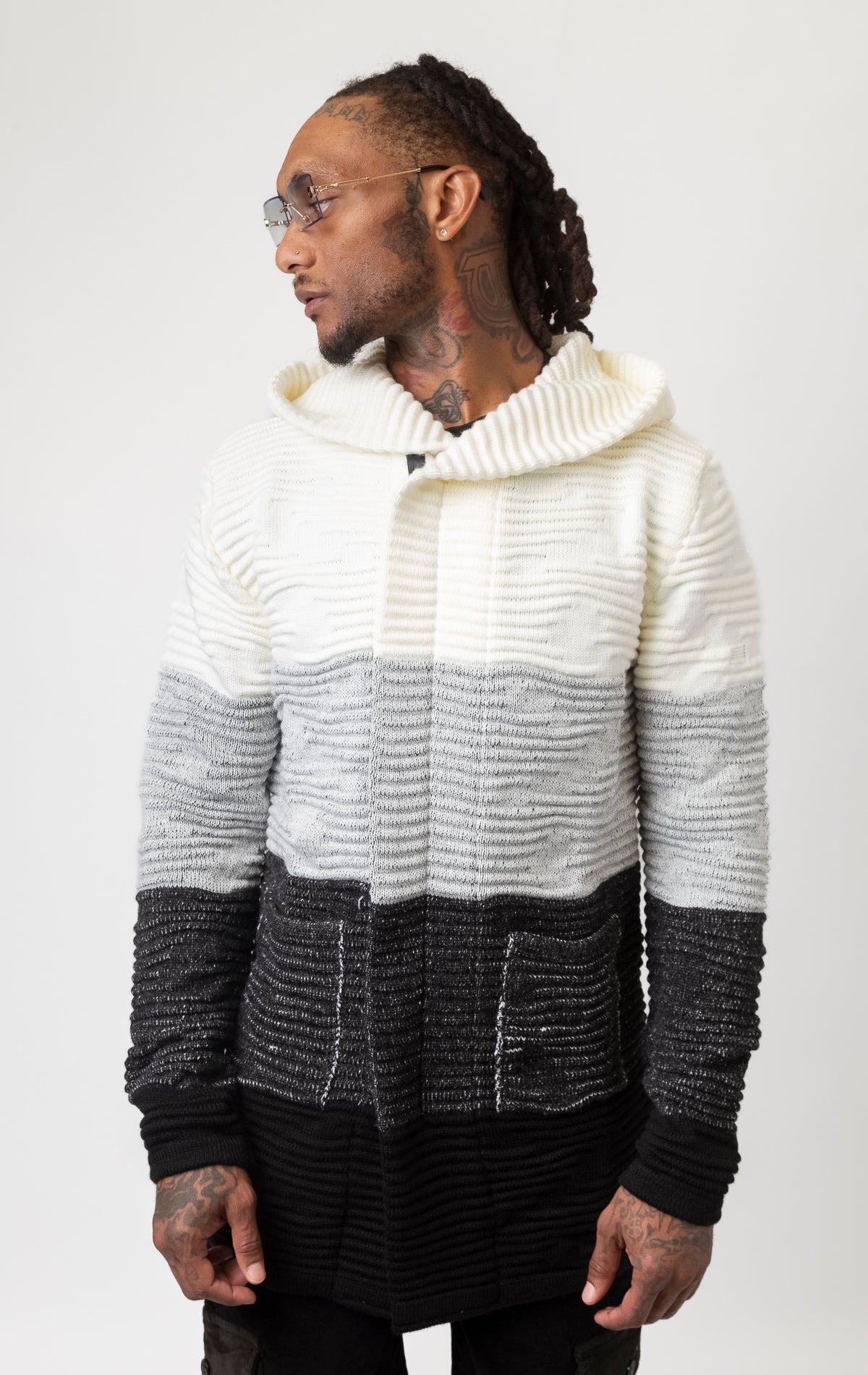 Three-tone cardigan sweater featuring a hoodie.
