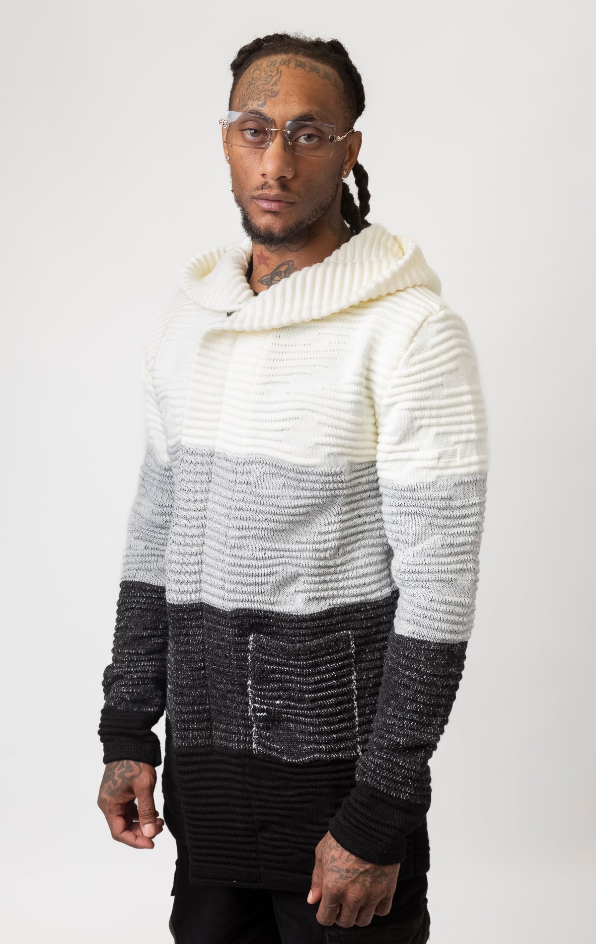 Three-tone cardigan sweater featuring a hoodie.